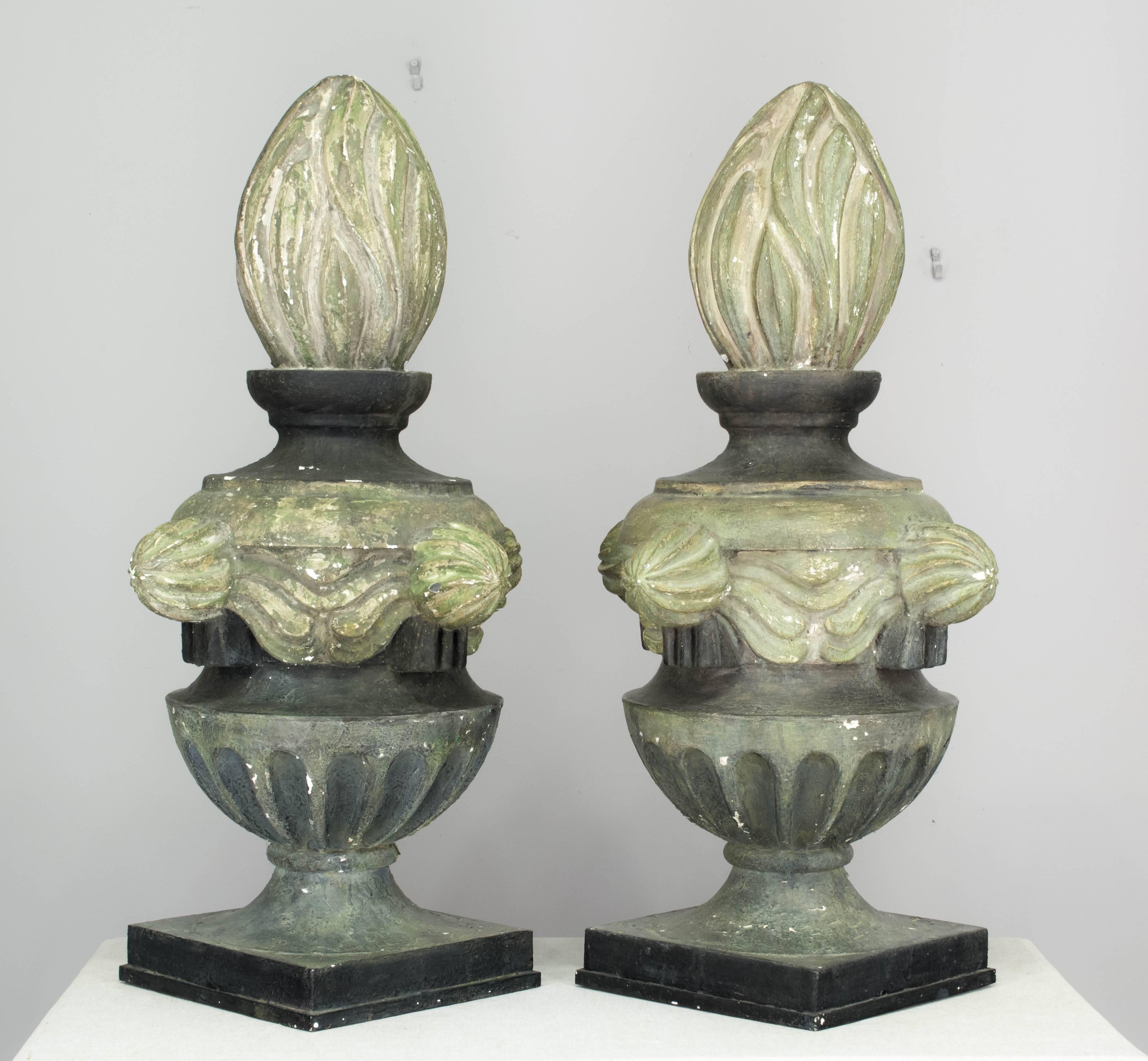Pair of large French architectural  flame finials. Bases are gray painted metal and the flame details are verdigris painted zinc. Nice sculptural forms with beautiful grey green color. Original patina with paint flaking off in places. Overall: 41