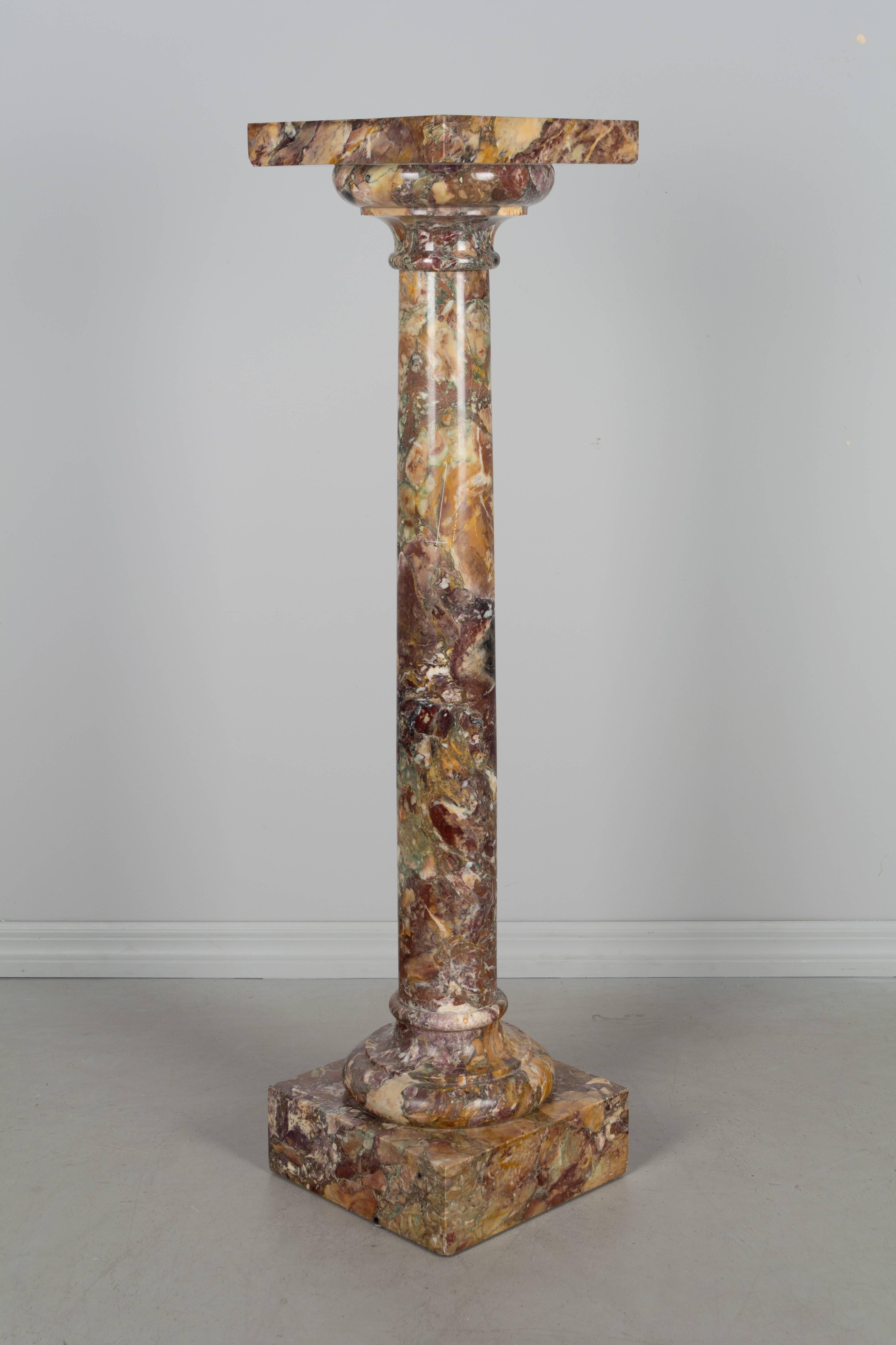 19th century French marble column pedestal. Beautiful color and veining. In three parts. Excellent condition with no chips, but there are scratches in the surface of the top. A good pedestal for displaying a sculpture or for use as an architectural
