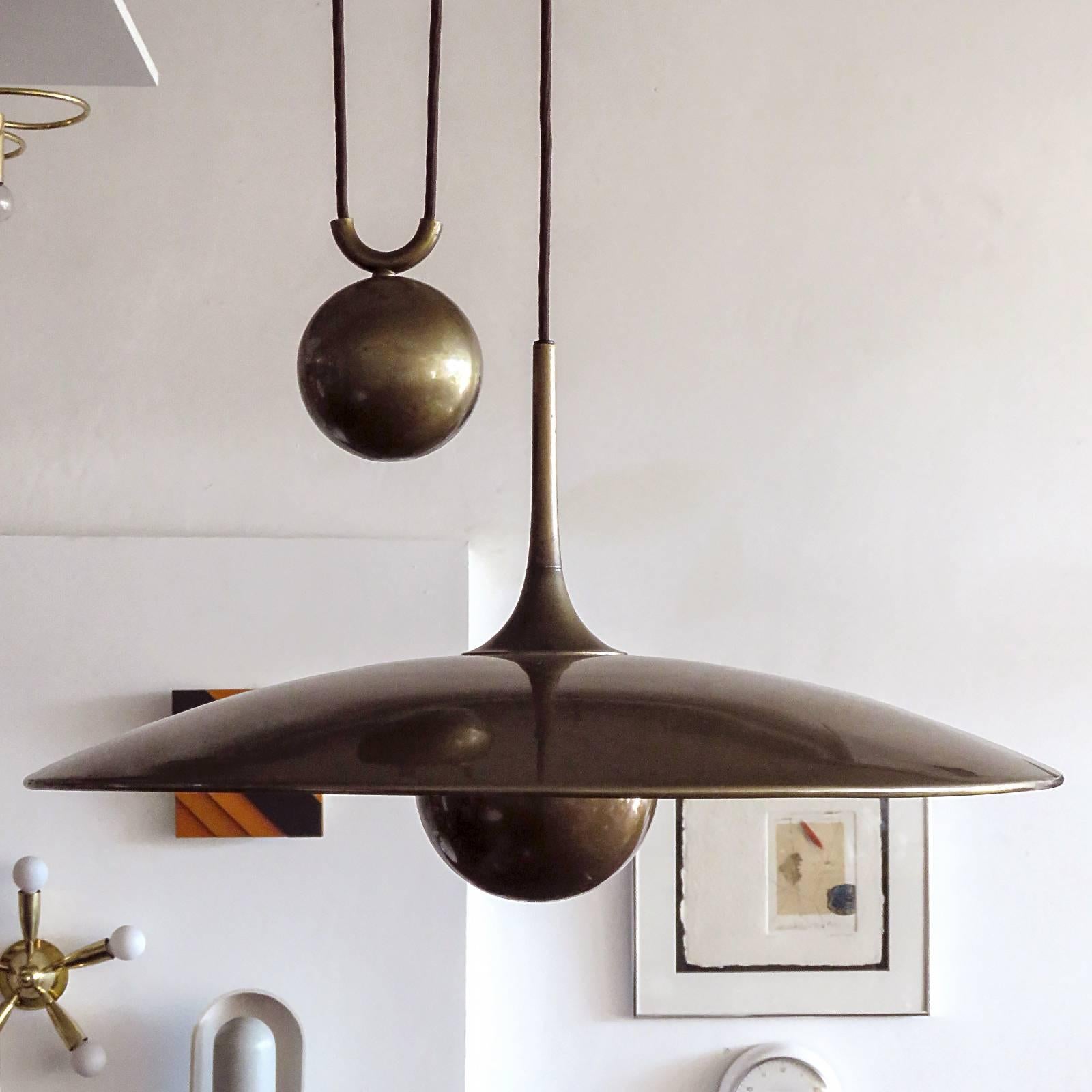 Beautiful large dark brass saucer pendant by Florian Schulz, with very heavy solid brass sphere pulley mechanism, early production, current extension capability from 12
