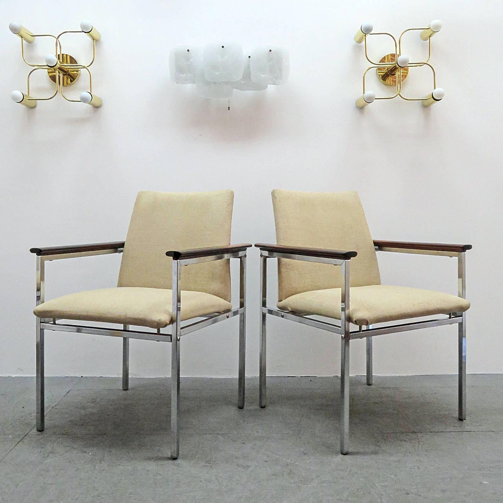 Wonderful set of four armchairs by Kai Kristiansen for Nipu Abyhoj, light beige wool upholstery on chrome-plated metal frames with palisander/rosewood armrests.