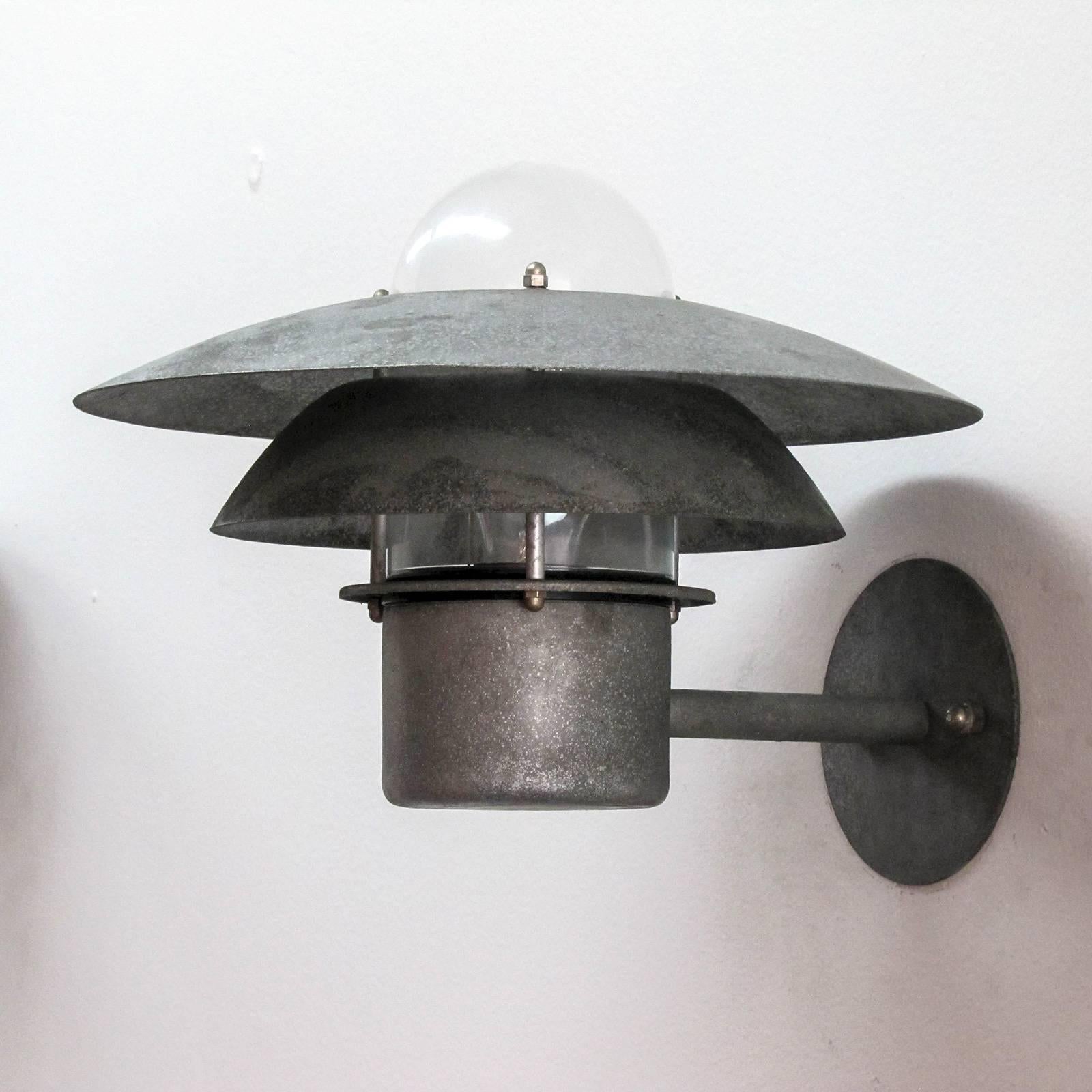 wonderful Danish outdoor wall light by Danalight in galvanized steel with glass
bulb enclosure.