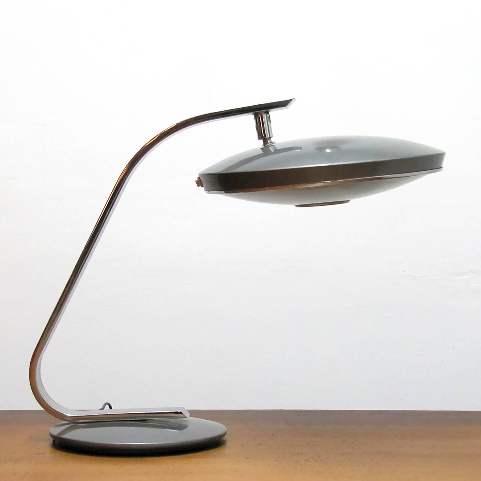 Elegant chrome and enameled metal desk lamp by Fase Madrid, Spain, articulating head, two bulb set up behind original glass diffuser, on/off switch on the shade rim.