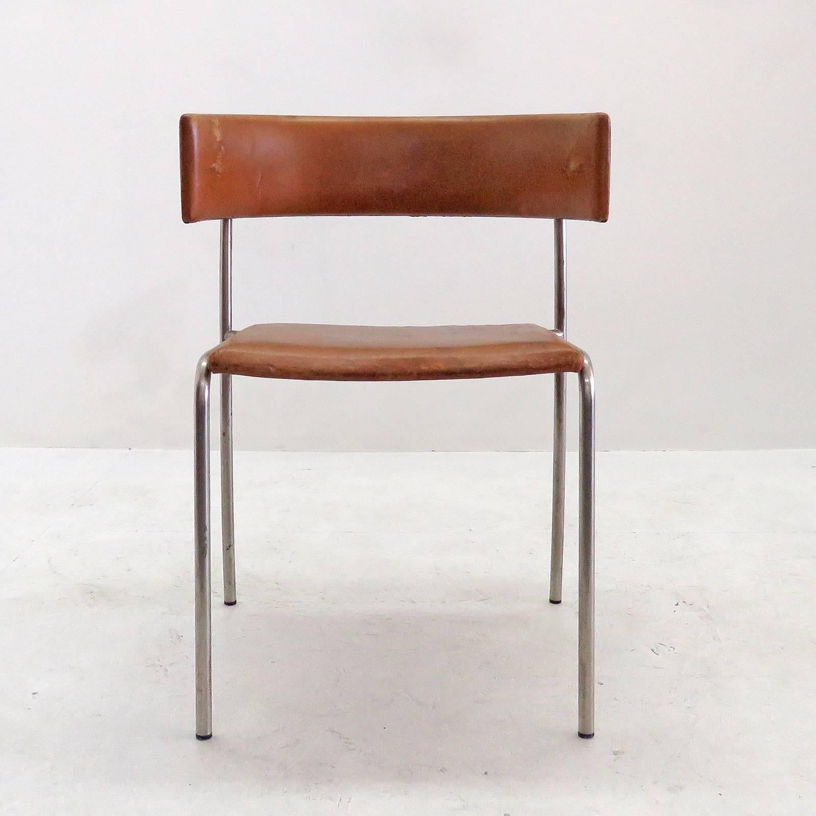 Rare pair of sculptural side chairs by Erik Karlström with patinated leather seat and backrest on Minimalist chrome frames, designed for the Civic Hall Orebro, Sweden, which was built between 1957-1965 with the interior designed by Erik Karlström