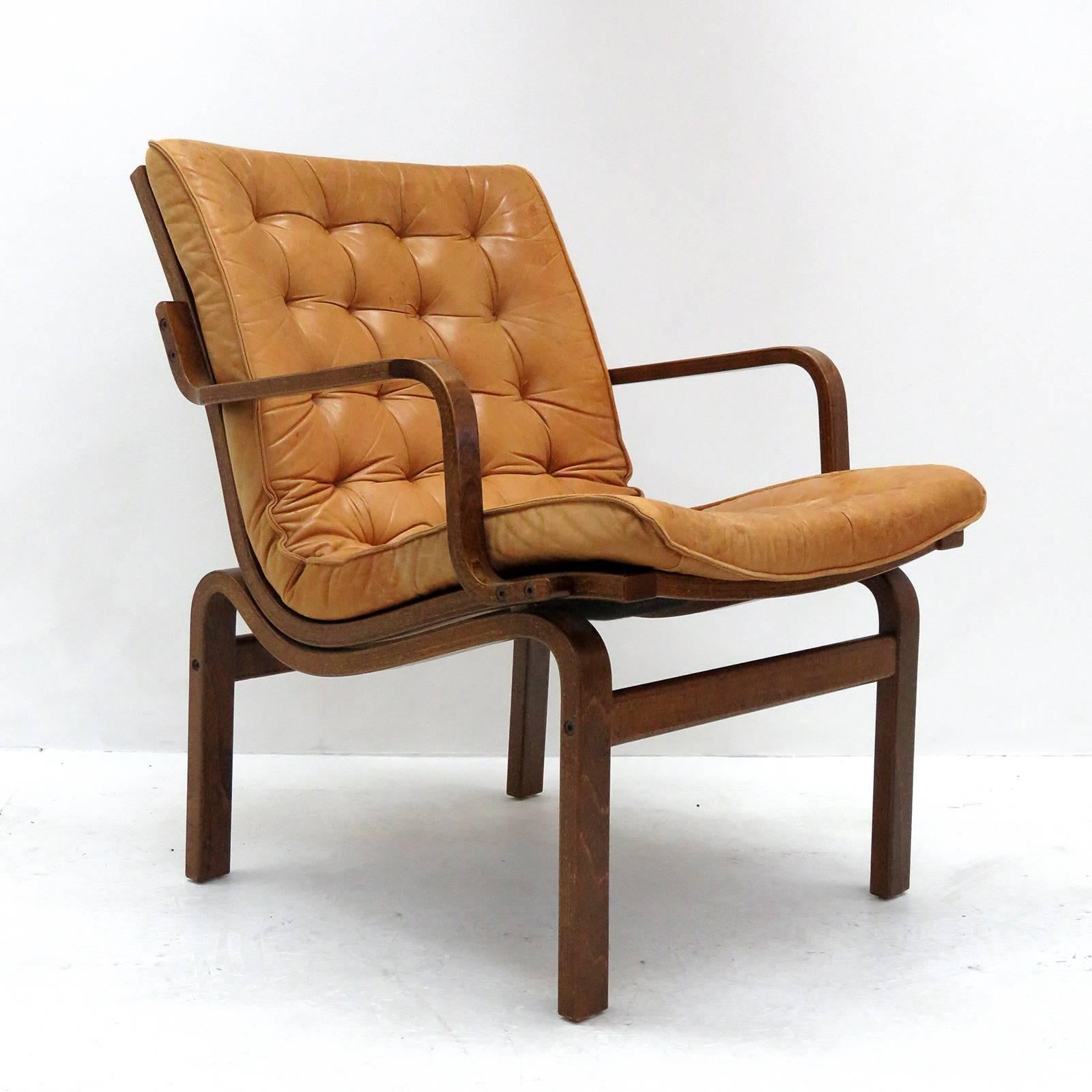 Striking 1950s Danish bentwood chairs, similar to Bruno Mathsson Eva chairs, with cognac colored tufted leather cushions, great patina.