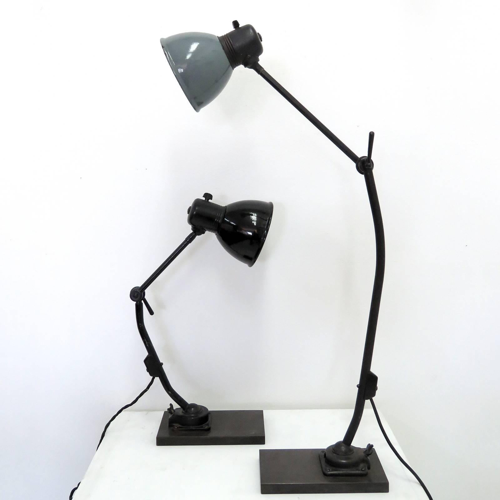 Striking 1930s task lamps by Marianne Brandt for Kandem (1934-1939), with custom solid steel bases, can be used as wall or table lamps, both have a ball joint at the original base and head, as well as a rotational joint in the center. No.802PL