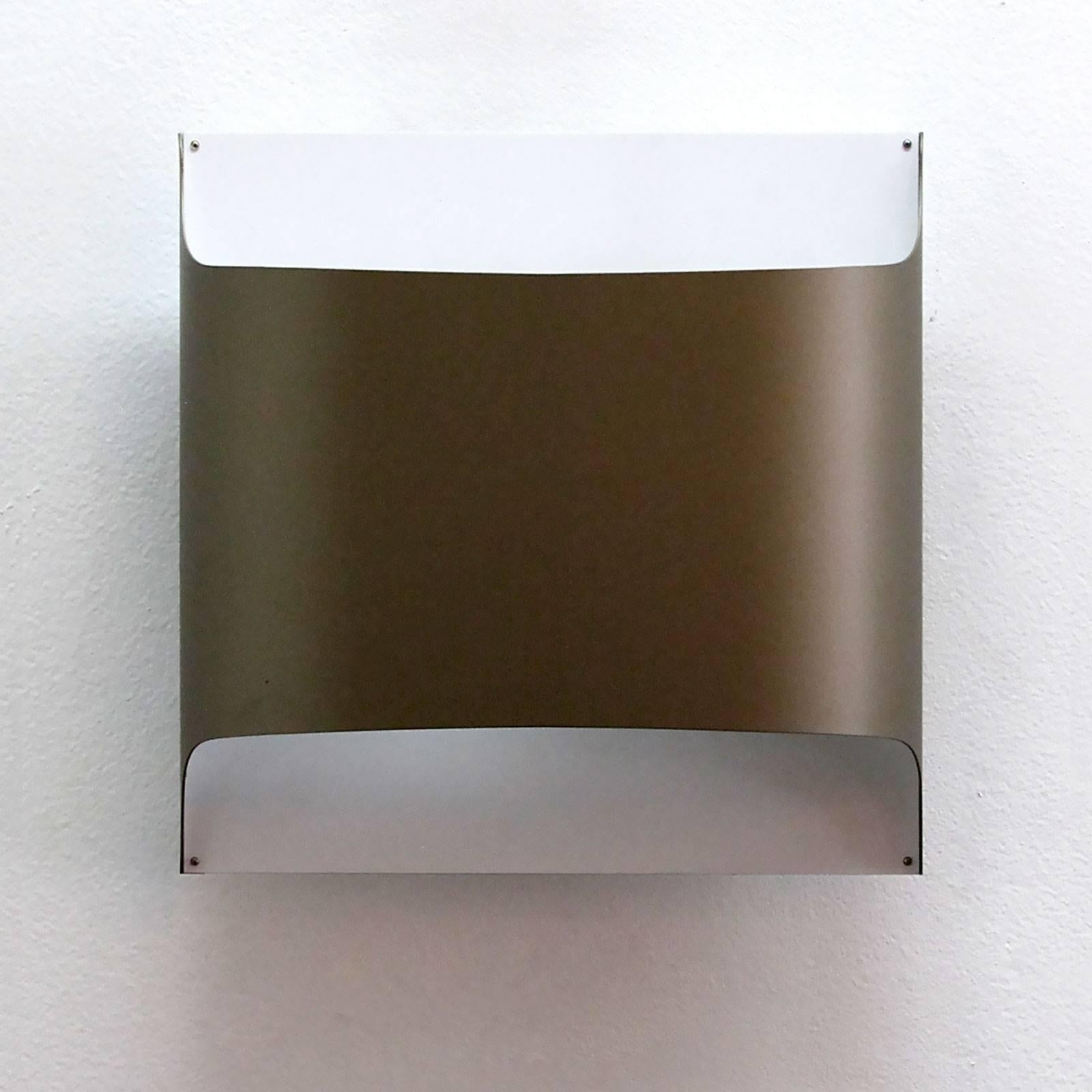 Minimalist folded metal wall lights by Staff of Germany in ivory-white and near bronze-brown color, can be used as flush mount ceiling lights as well. Designed by R. Kruger & D. Witte in 1968. Priced individually.