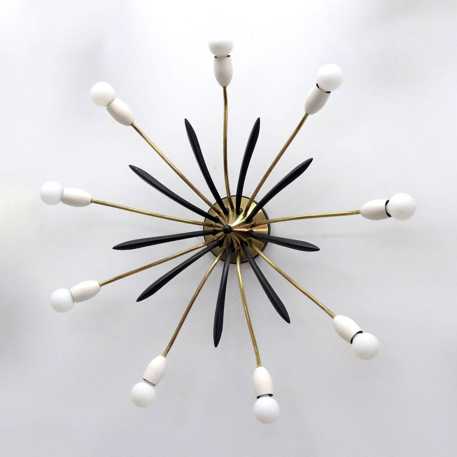 Wonderful large-scale German nine-arm Sputnik in brass and enameled metal, can be used as wall or ceiling flush mount fixture.