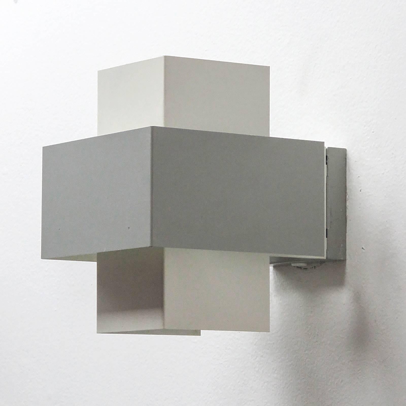 Elegant geometric wall lights by Philips, Netherlands, 1960s, in light grey and white enameled metal, marked.