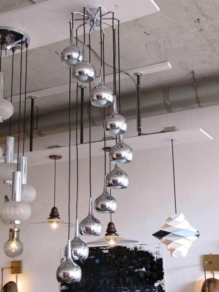 Stunning 1960s cascading chandelier possibly by Hans-Agne Jacobsson, with ten individual drop-shaped chrome-plated steel pendants measures: 7.5in. x 4.5in., adjustable in length and configuration, current total drop 56