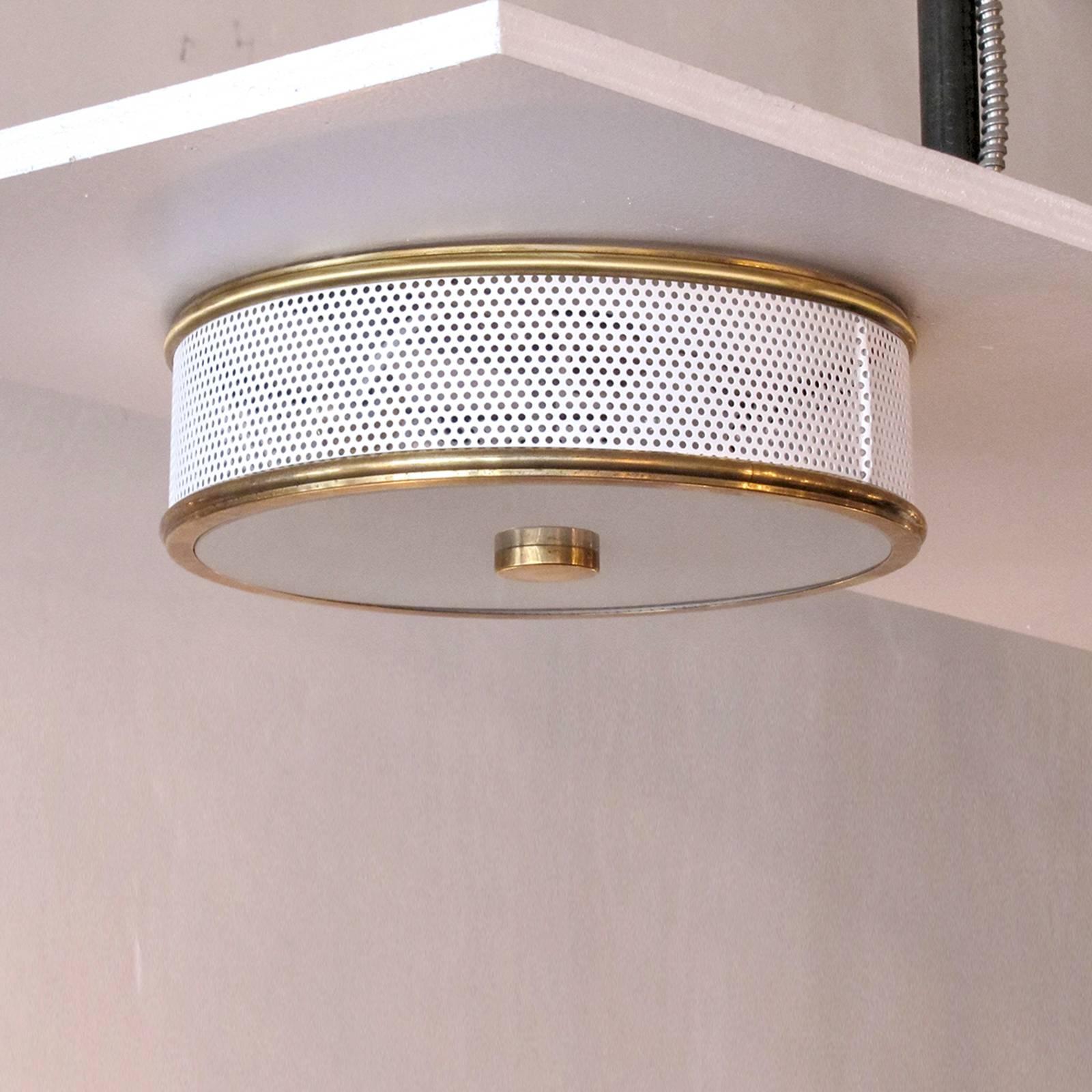 elegant flush mount ceiling light attributed to Mathieu Mategot, perforated enameled metal ring with brass rims and sandblasted glass disc