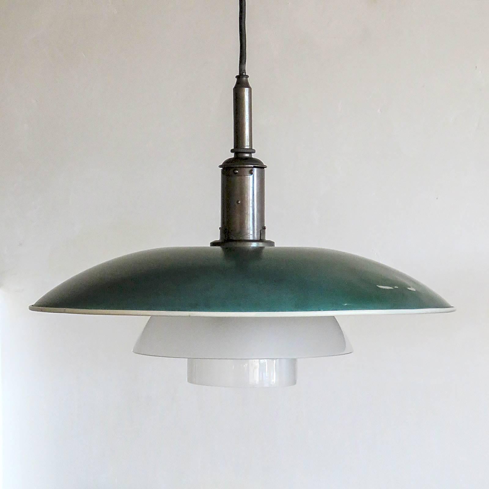 stunning early 1930's PH 5/4 Pendant by Poul Henningsen for Louis Poulsen with green enameled metal top shade, center and bottom shade in frosted glass and diffuser in matte frosted glass, patinaed brass bayonet shade holder and patinaed brass