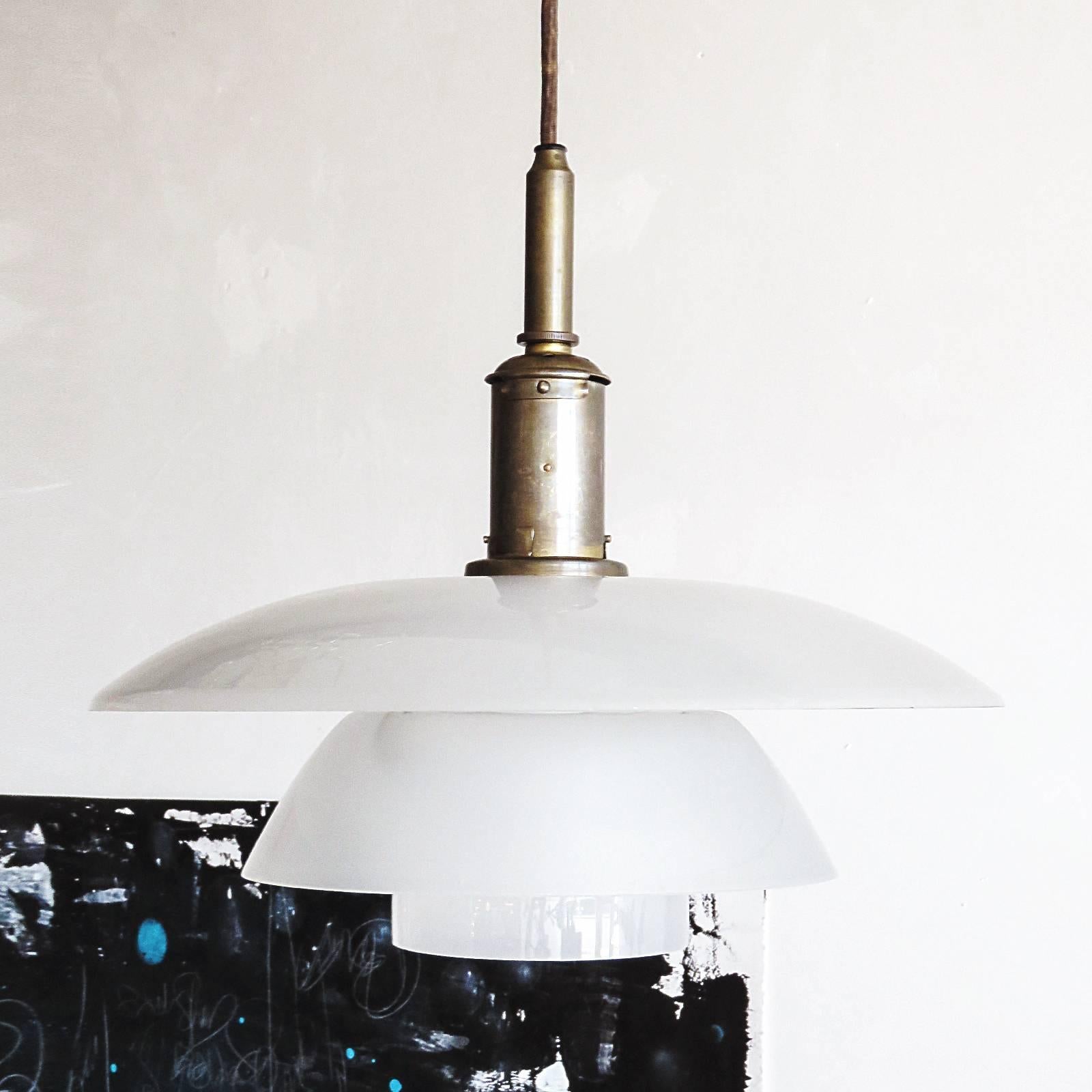 rare PH 4/4 pendant light by Poul Henningsen for Louis Poulsen with original shade set, in frosted glass and diffuser in matte frosted glass, original patinated brass bayonet socket housing and patinated brass canopy.