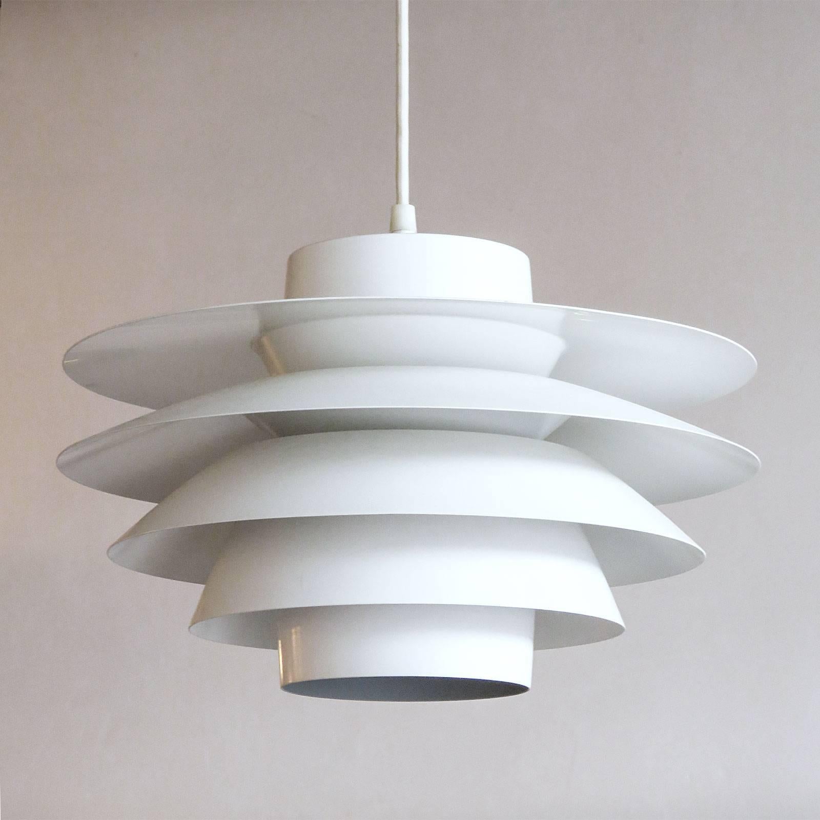 Wonderful large tiered 'Verona' pendants, designed by Sven Middleboe for Nordisk Solar Compagni in Denmark in 1962. These all white five ringed aluminum pendants are perfect for above a dining table, providing a nice soft diffused light. ONE