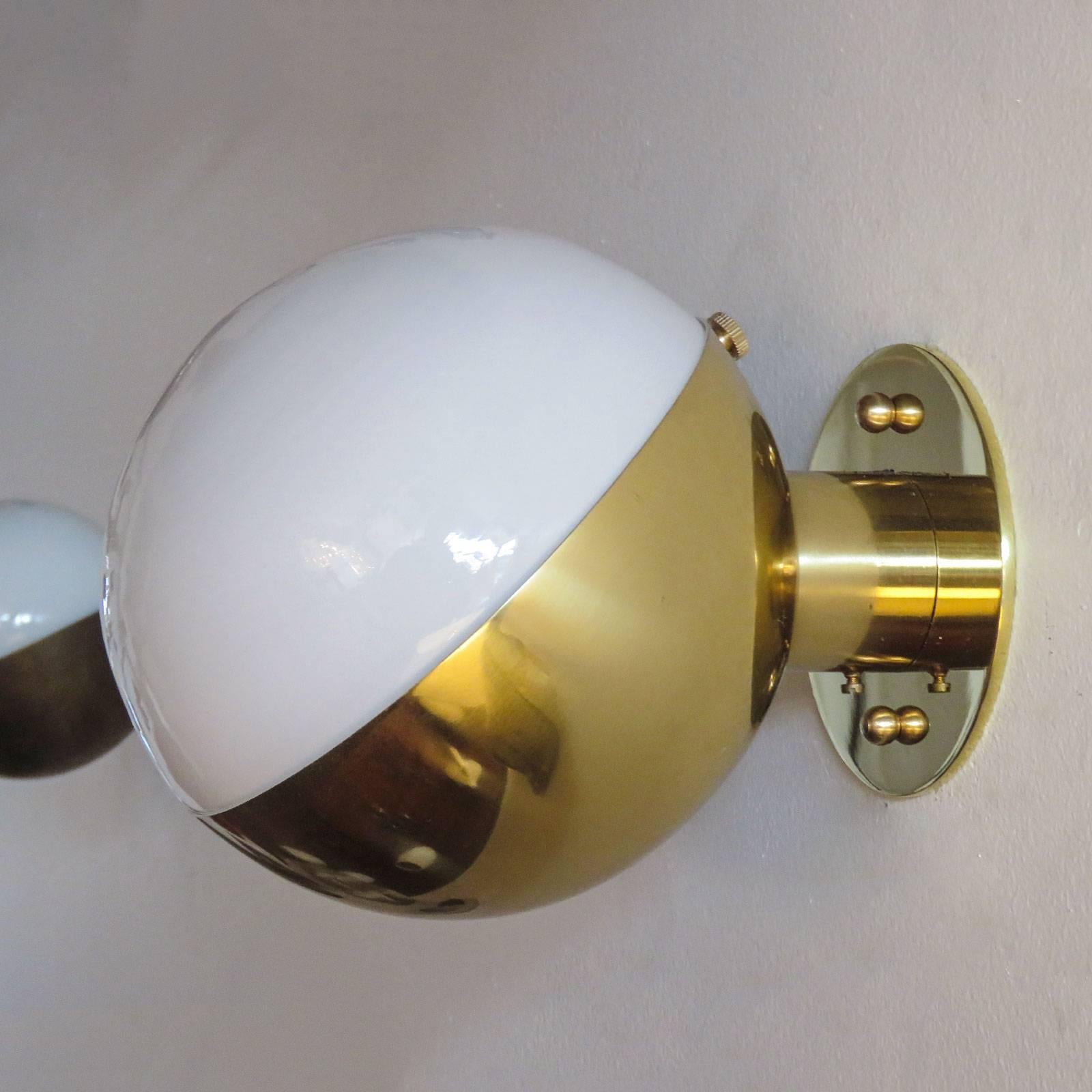 Remarkable 'Radiohuset' wall light, by Vilhelm Lauritzen for Louis Poulsen, in polished brass and opaline glass designed in 1931 for the Broadcasting House in Copenhagen.