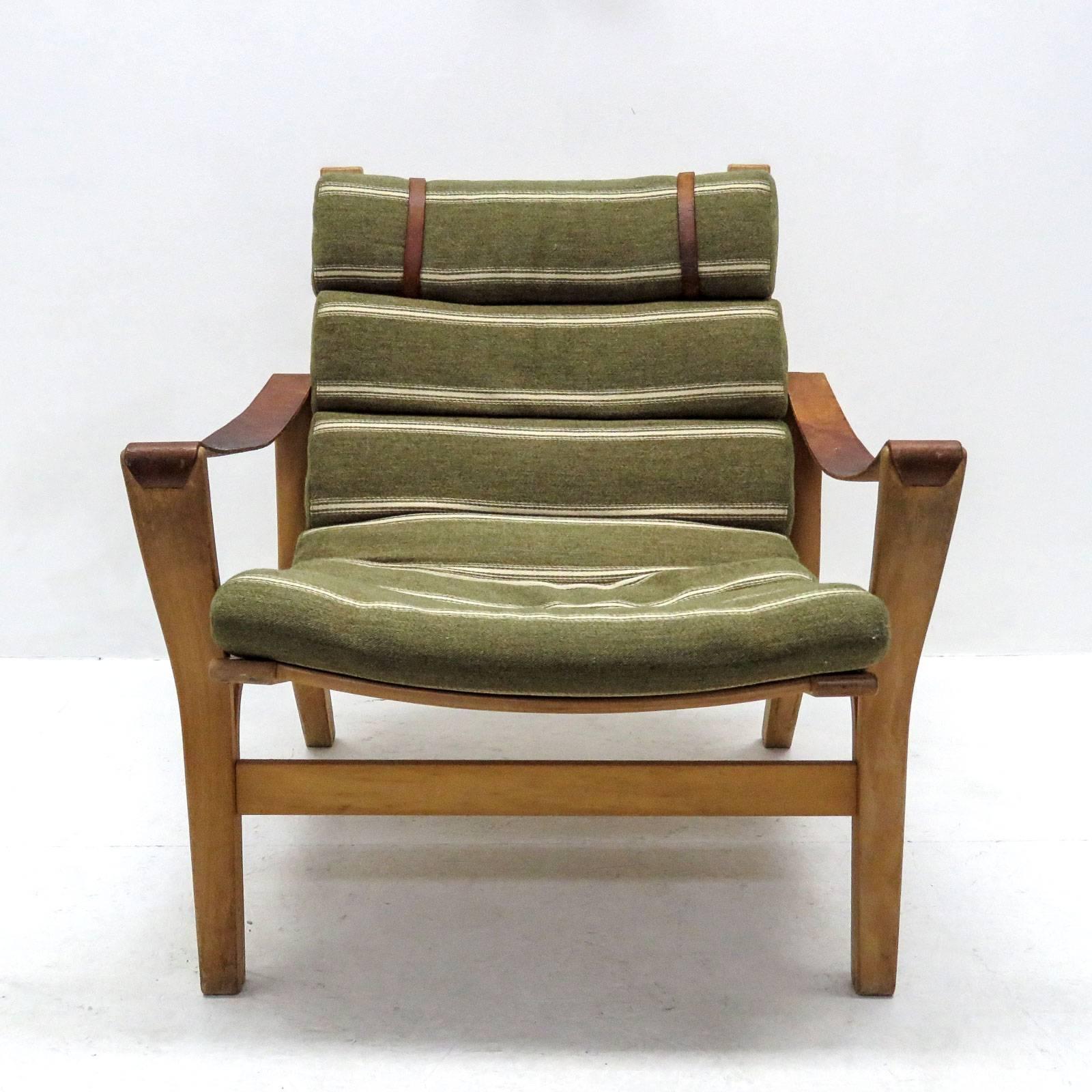 Wonderful Danish armchair in beech bentwood with armrests in leather, upholstery consists of seven linked wool cushions.
  