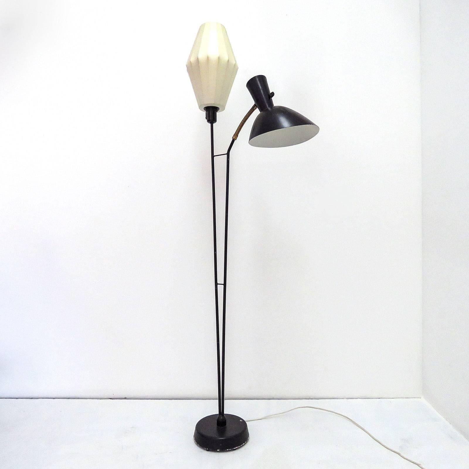 rare 1950's Swedish double arm floor lamp by Hans Bergström for Ateljé́ Lyktan in Åhus, Sweden, with one standing light with a resin cocoon shade and a down-light double cone metal shade with flexible brass arm and perforations to the shade,