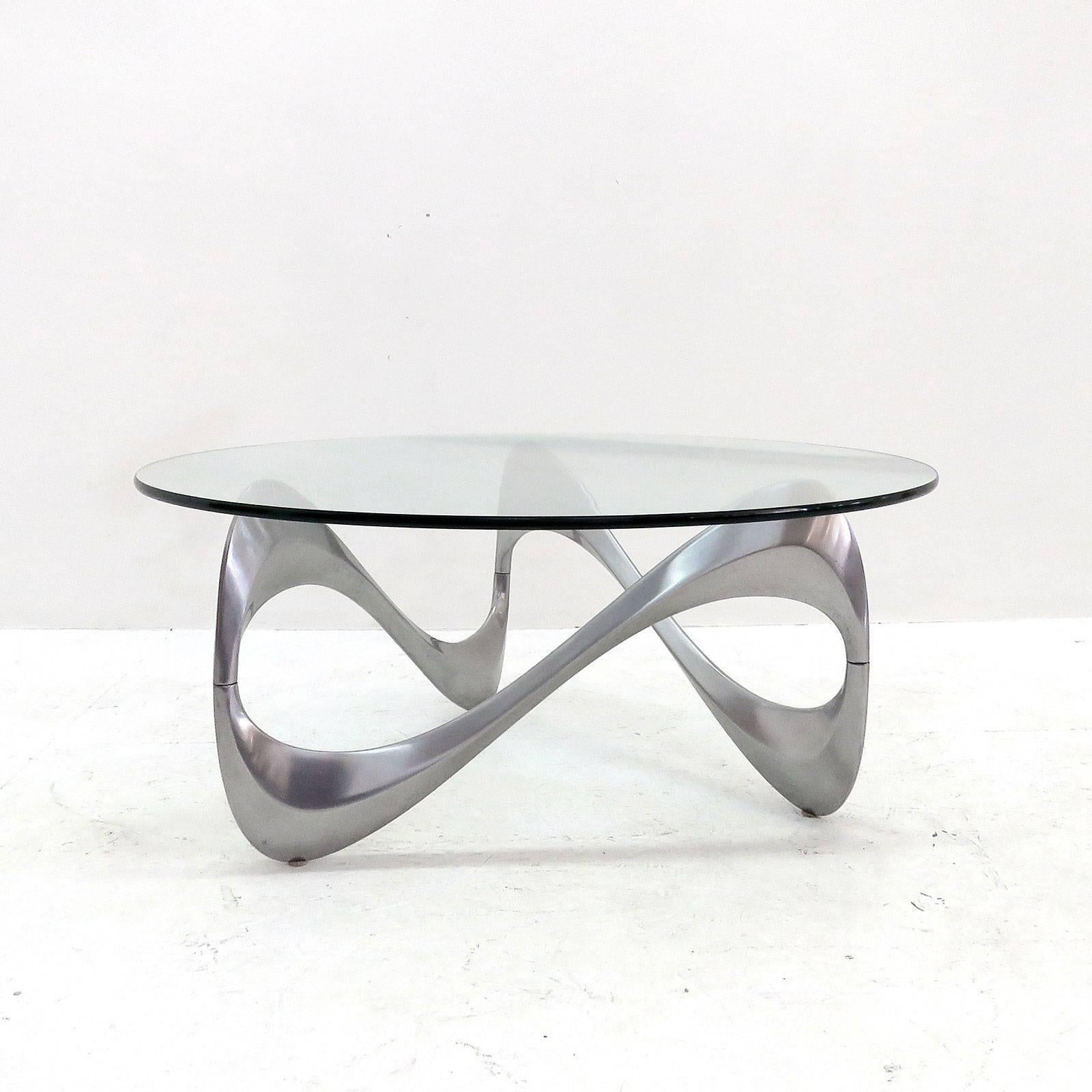 Rare sculptural three-piece aluminium "Schlangentisch" [snake table] coffee table with 40" glass top.