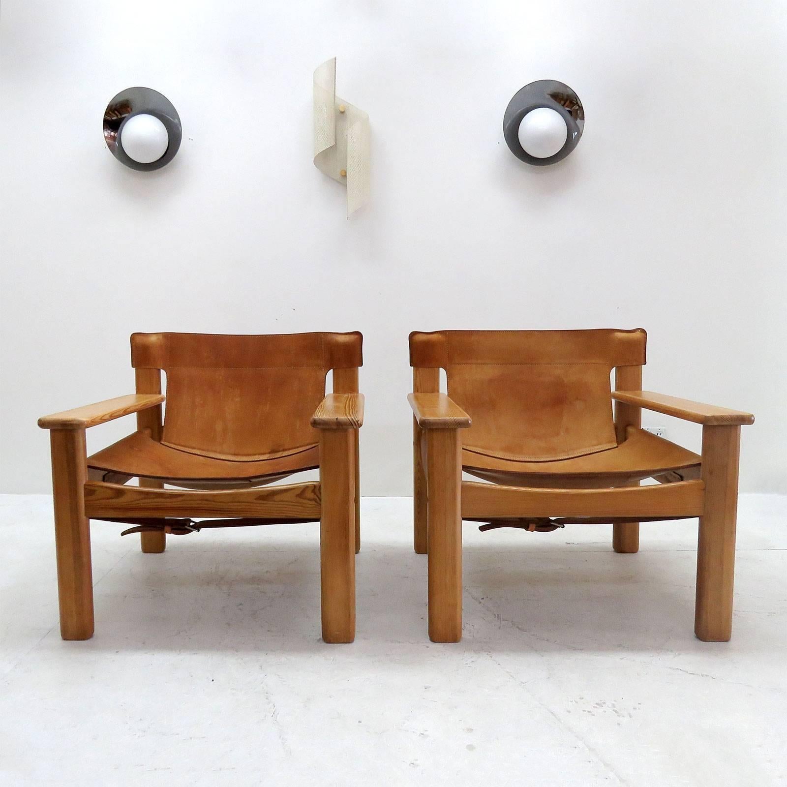 Bold and comfortable Danish modern lounge chair by Karin Mobring, Sweden, designed in 1977, oversized pine frame with thick cognac colored leather with incredible patina.