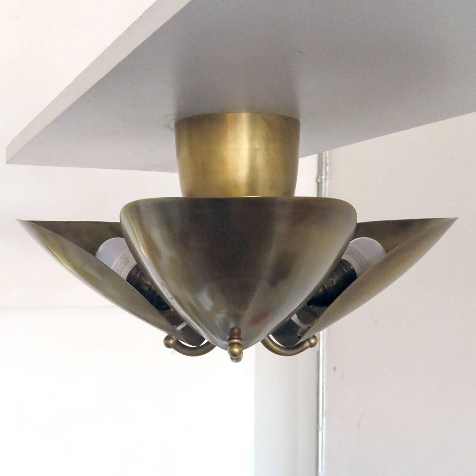 Wonderful, organic three-petal patinaed brass flush mount by Gallery L7. Three E26 sockets per fixture, max. wattage 40w each, UL listing available upon request for an additional charge. Multiples available.