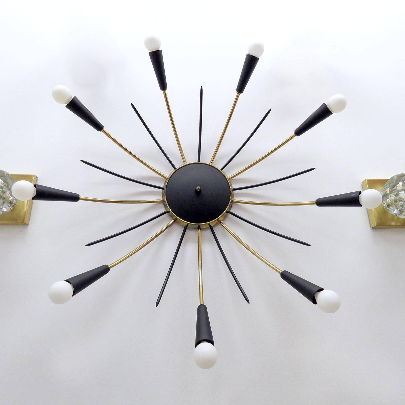 Stunning large-scale nine-light Sputnik flush mount light with nine alternating black enameled decorative prongs, wall or ceiling mounted.