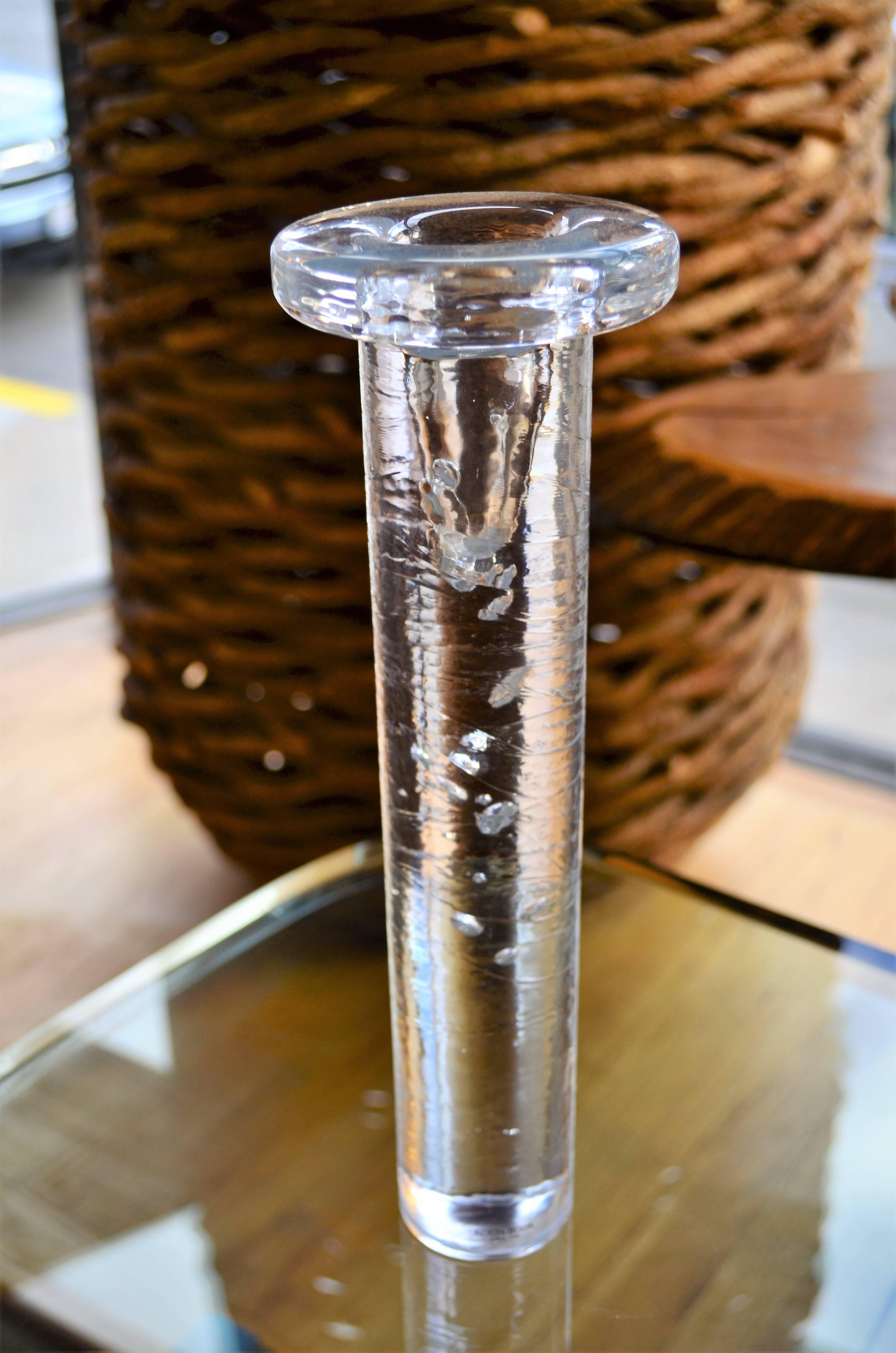 A tall glass candlestick by Kosta Boda with bubble inclusions.
Please visit our 1stdibs storefront for other interesting holiday gift ideas.