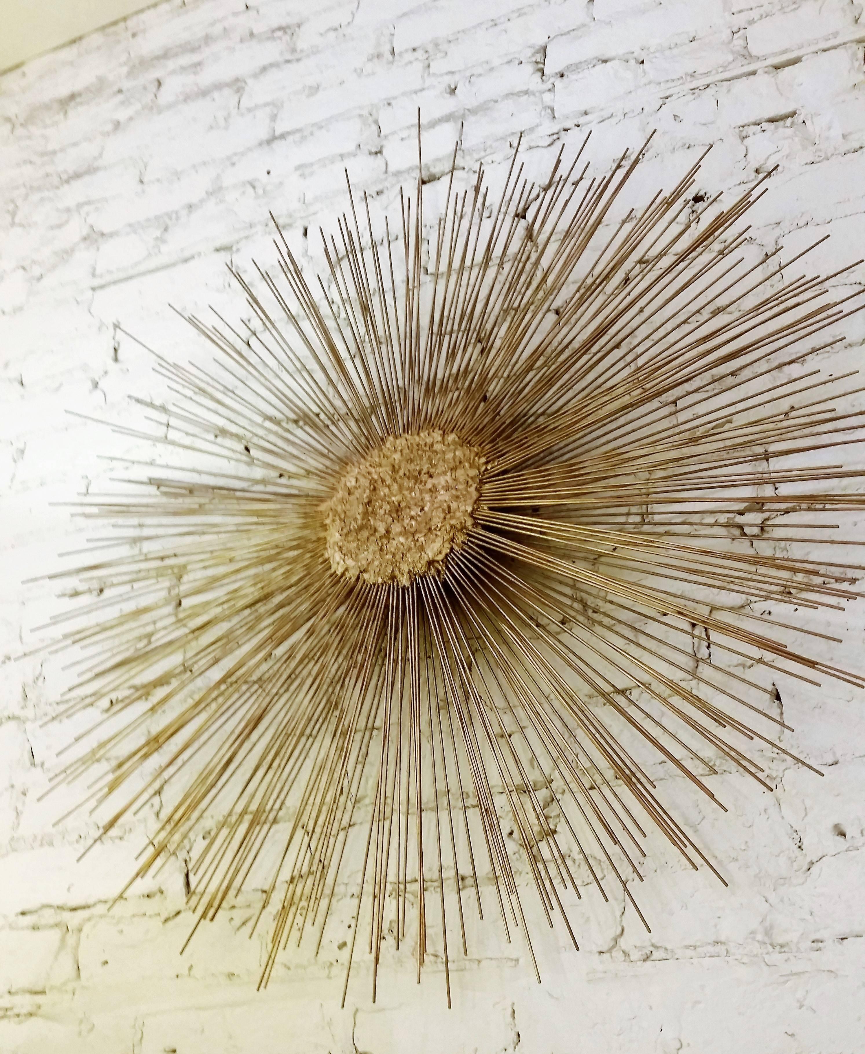 A Brutalist double layered metal Curtis Jere style Starburst wall sculpture by William & Bruce Friedle.