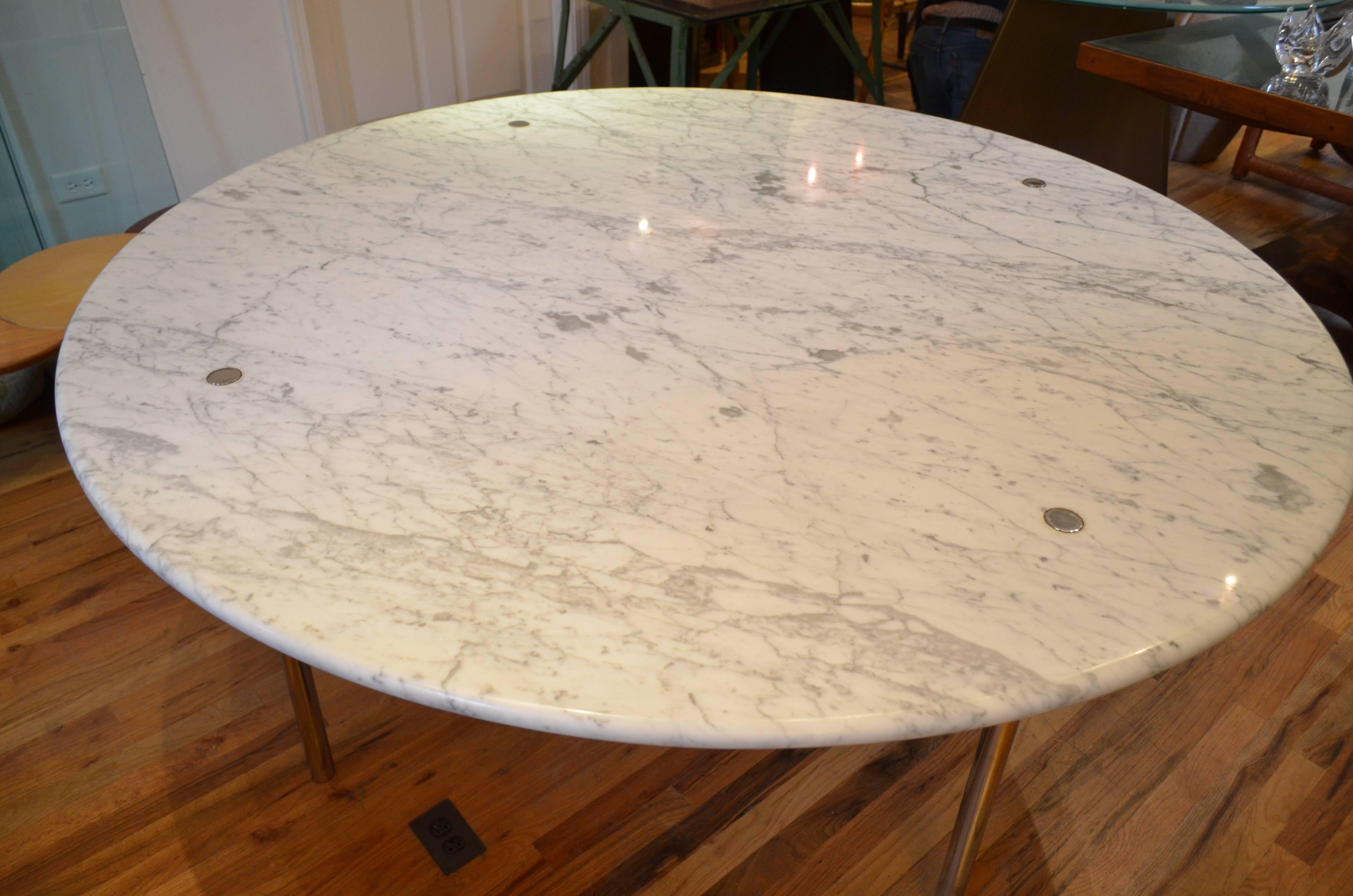 A colossal round Carrara marble dining table designed by William Katavolos, Ross Littell and Douglas Kelly for Laverne International. The table is supported on four slender chrome plated steel legs.
