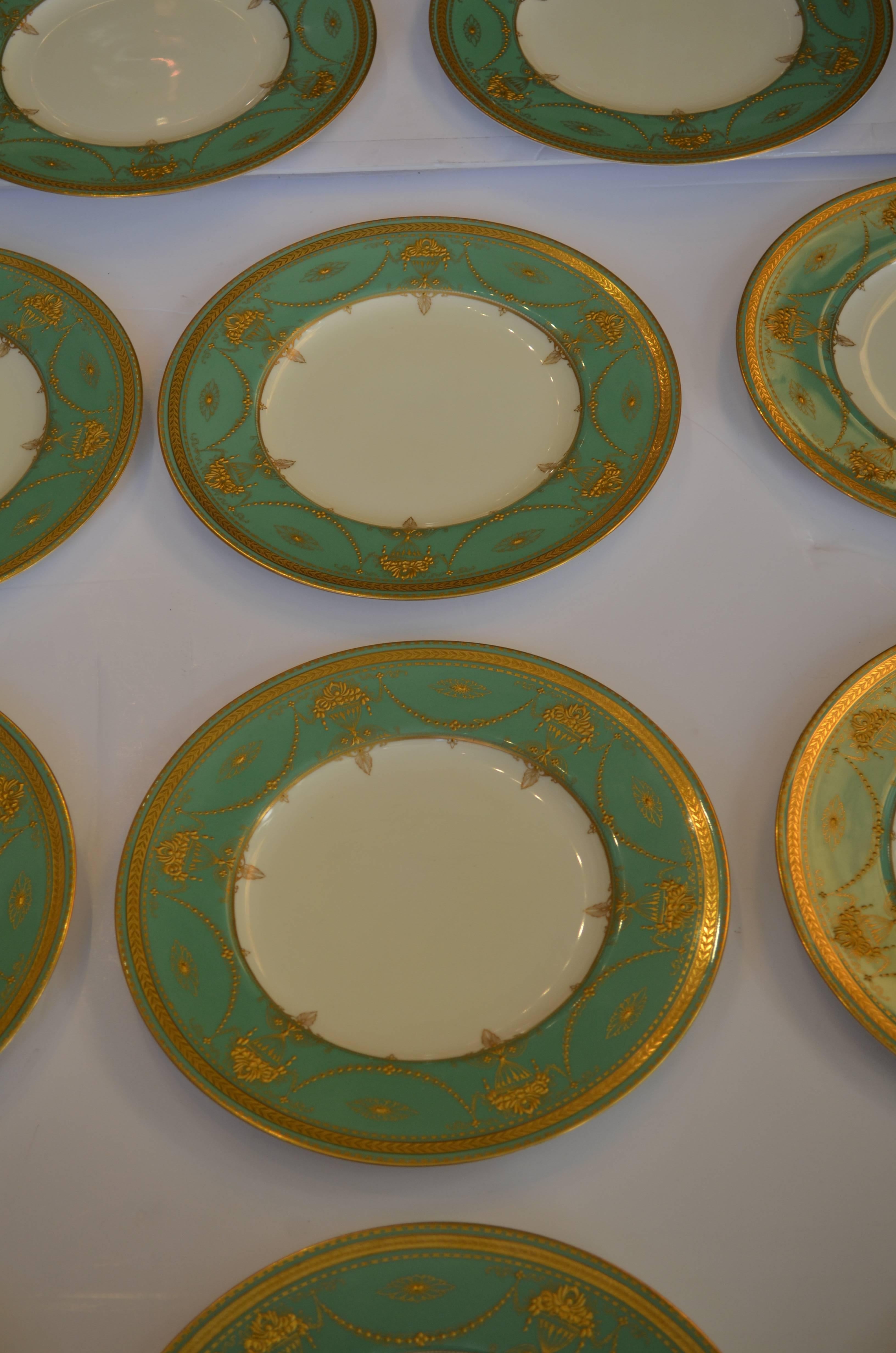 Opulent set of 11 gilded age gold rimmed dinner plates,
with a wide emerald green border. hand-painted raised gold,
gilt detailing featuring neoclassic urns and swag motifs.
The set was retailed by Richard Boggs in Boston.
Perfect for Christmas or