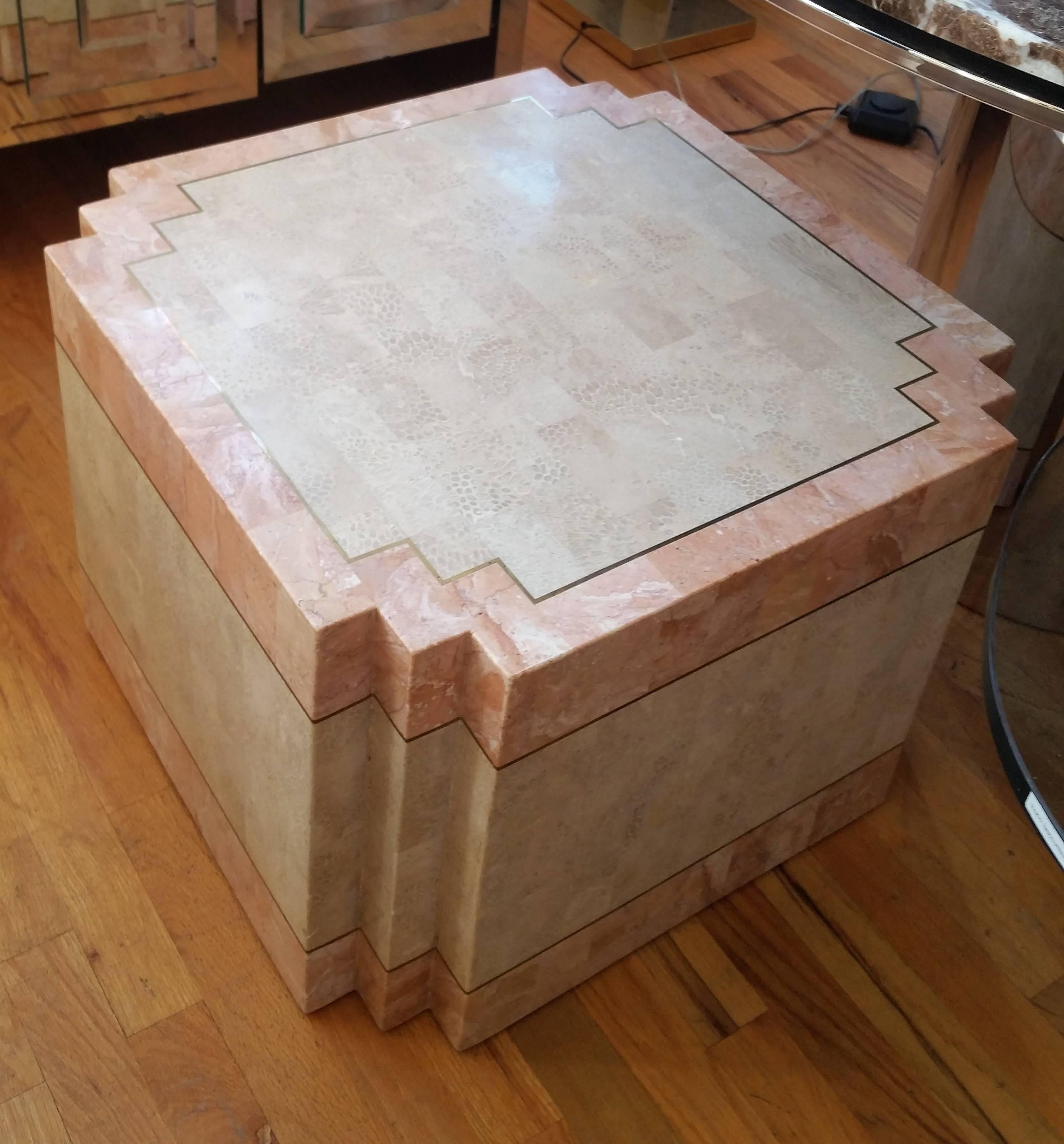 A tessellated stone occasional table with brass inlay.
Would also work well as a coffee table.