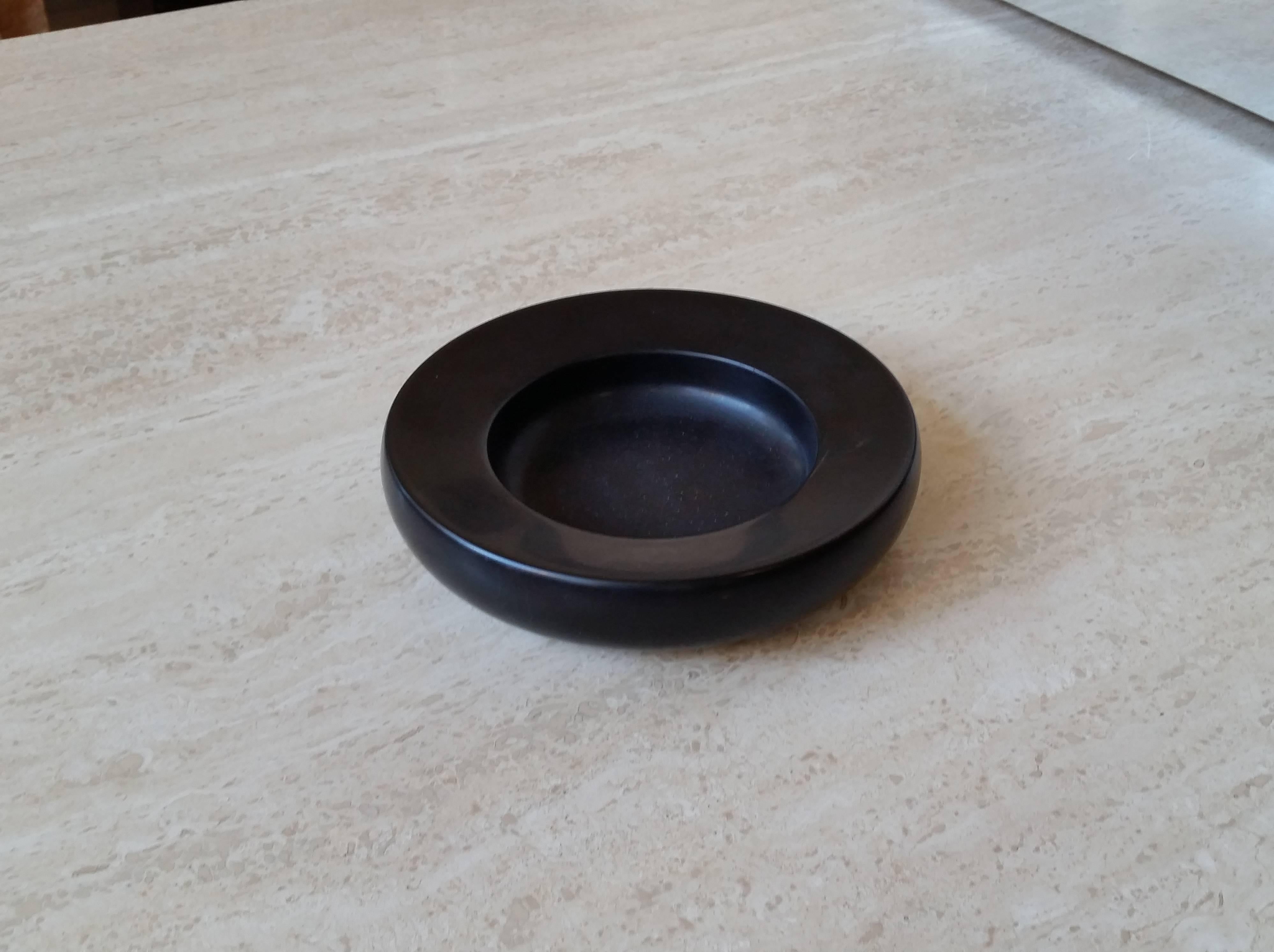 A small bowl or catch all in Belgian black marble
by Up & Up. The Garnerone decorative object was designed in 1977
by Egidio Di Rosa and Pier Alessandro Giusti.
Wonderful proportions. Great table top  or desk accessory.
Please visit our 1st Dibs