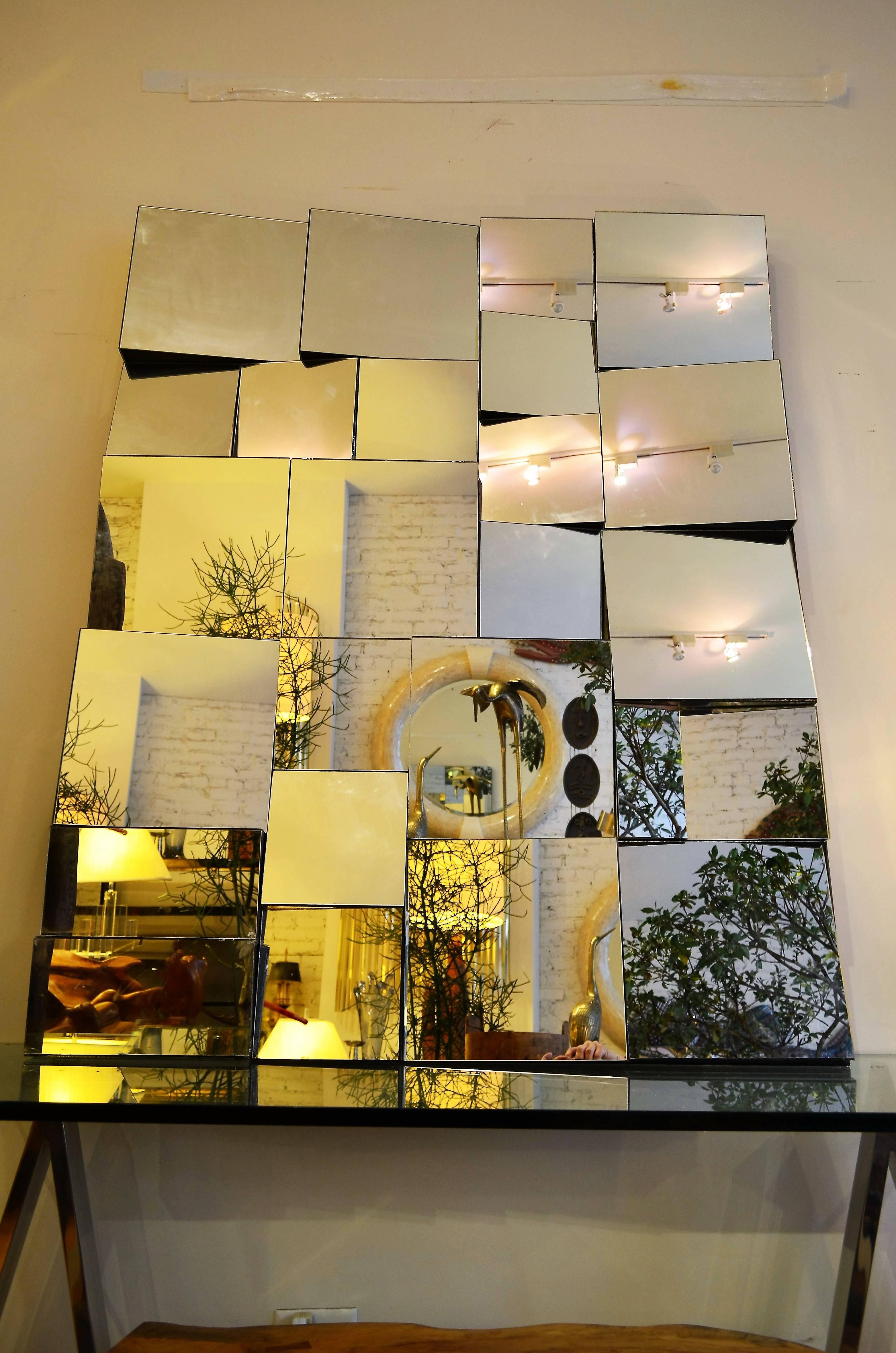Large Neal Small  Slopes Mirror.
Cubist style mirror in a black wood frame.
Can be hung vertically or horizontally.
Great sculptural wall art.