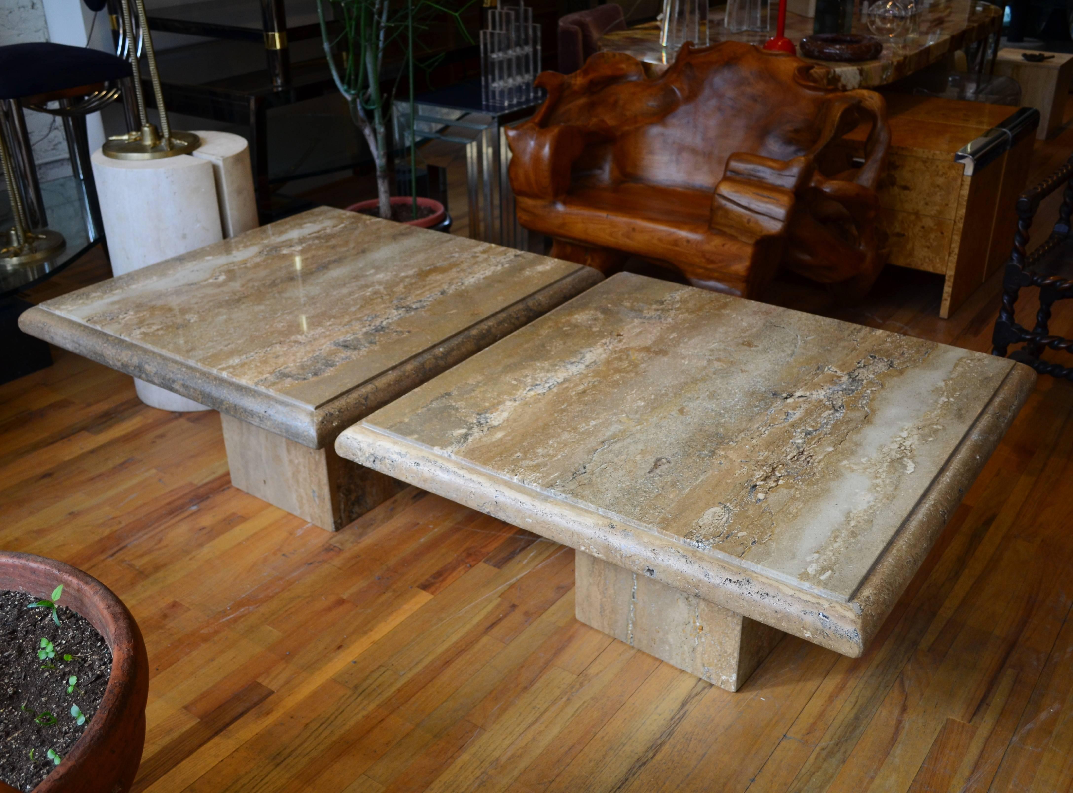 Italian Travertine pair of square pedestal coffee tables. 
The tables brown travertine tops have a robust active
vein pattern. Would also work well as side or end tables.