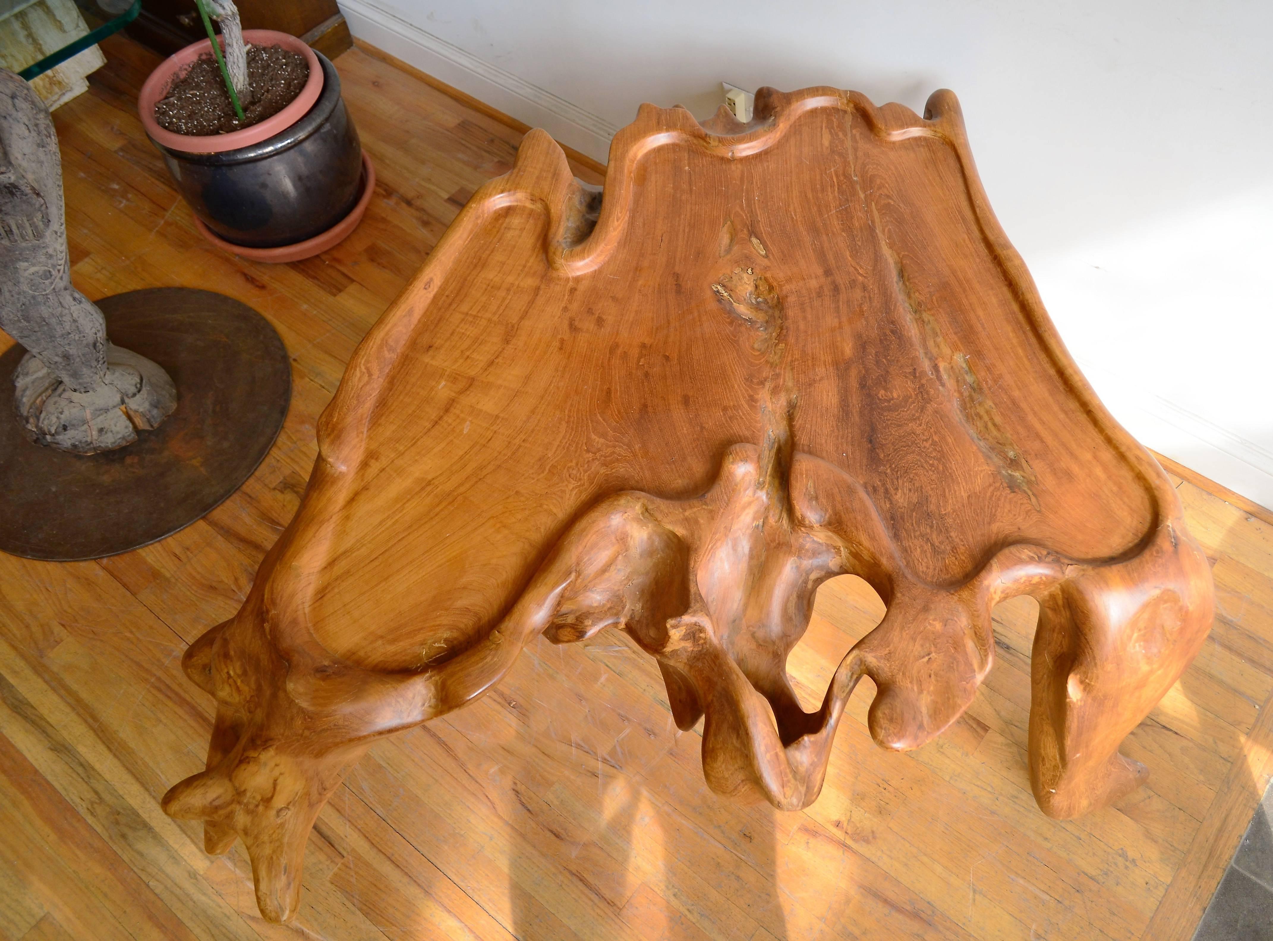An organic solid  burl wood  table. Could be used either as a coffee table
or as a side or end table.