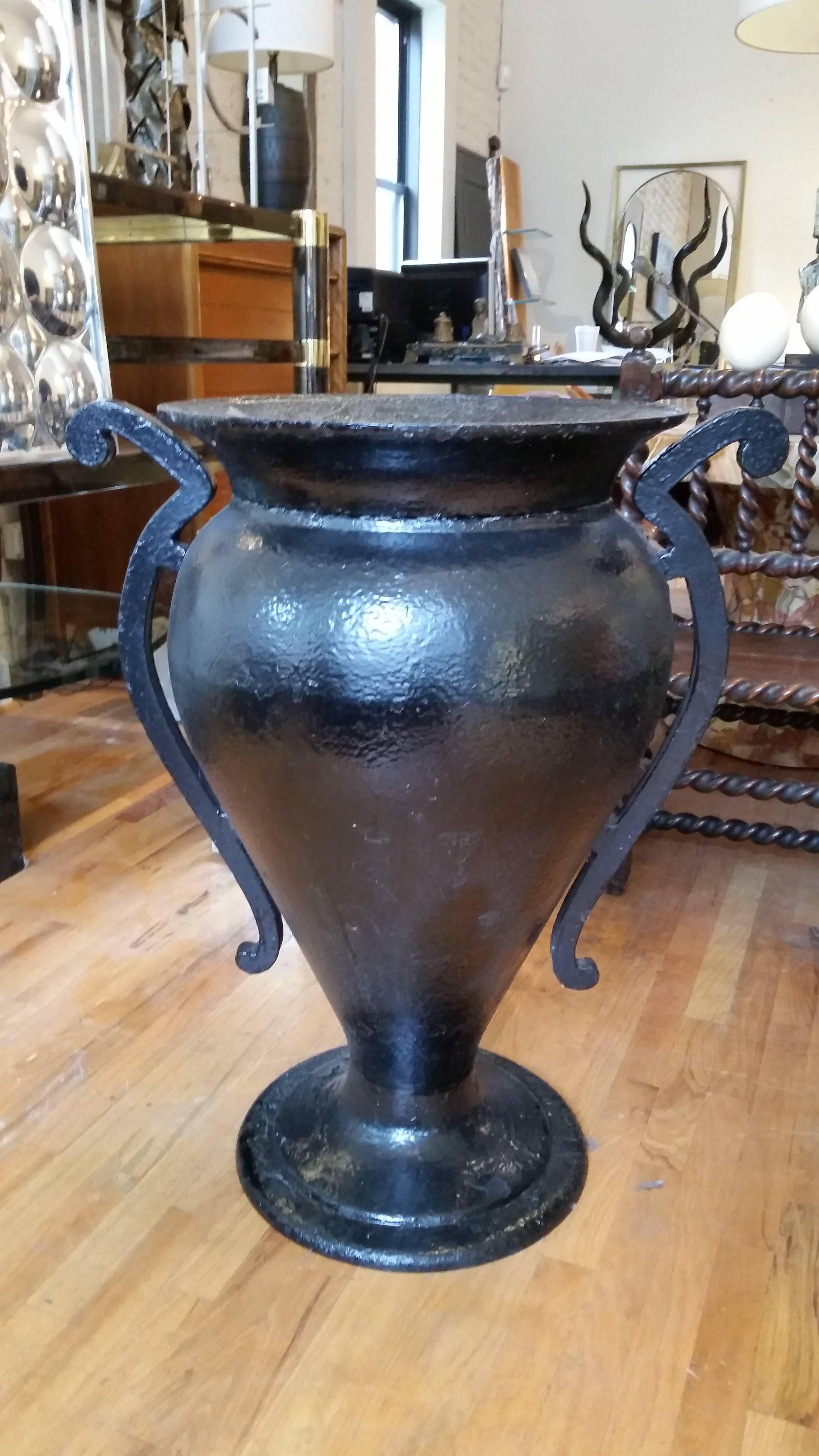 An imposing Art Deco urn.It is painted black.