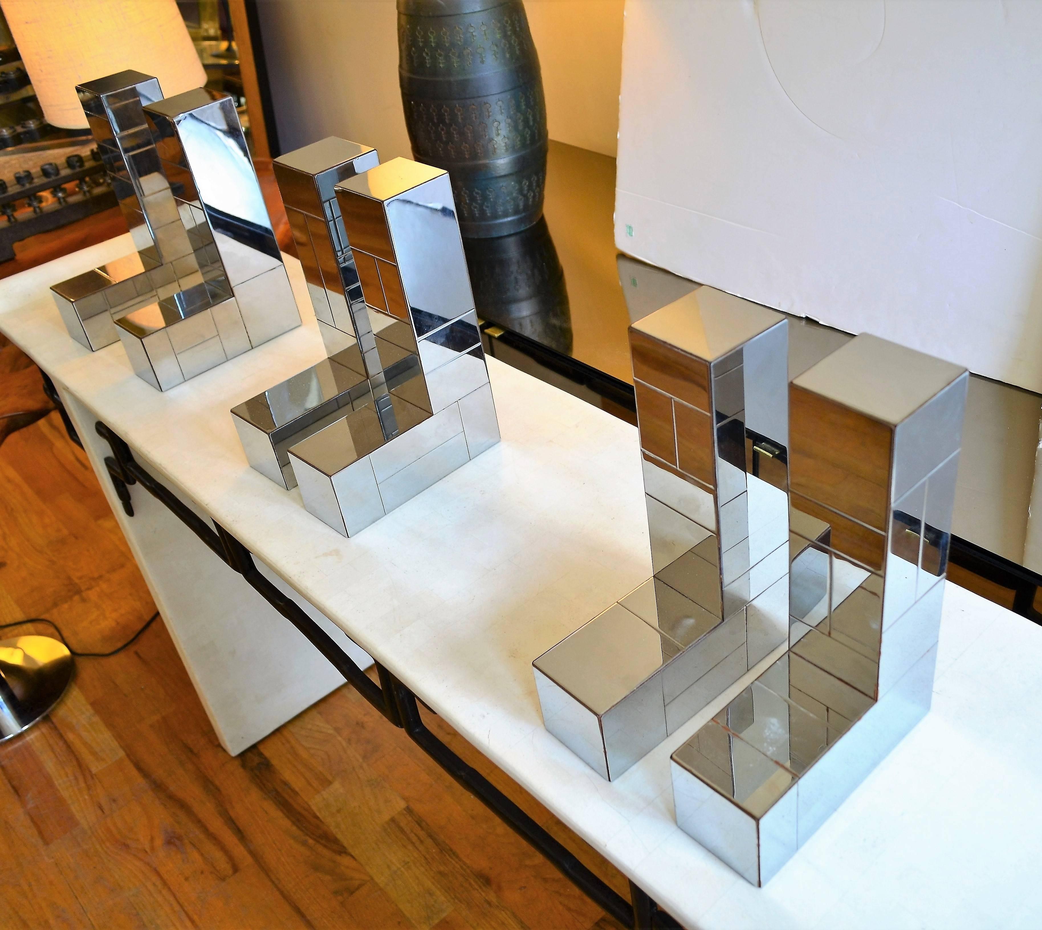 Paul Evans shelf brackets. This set of three brackets are part of his iconic Cityscape collection for Directional. The set comes with three thick glass shelves. Each measures 12 x 48. Please note that one of the shelves has a very small chip.

   