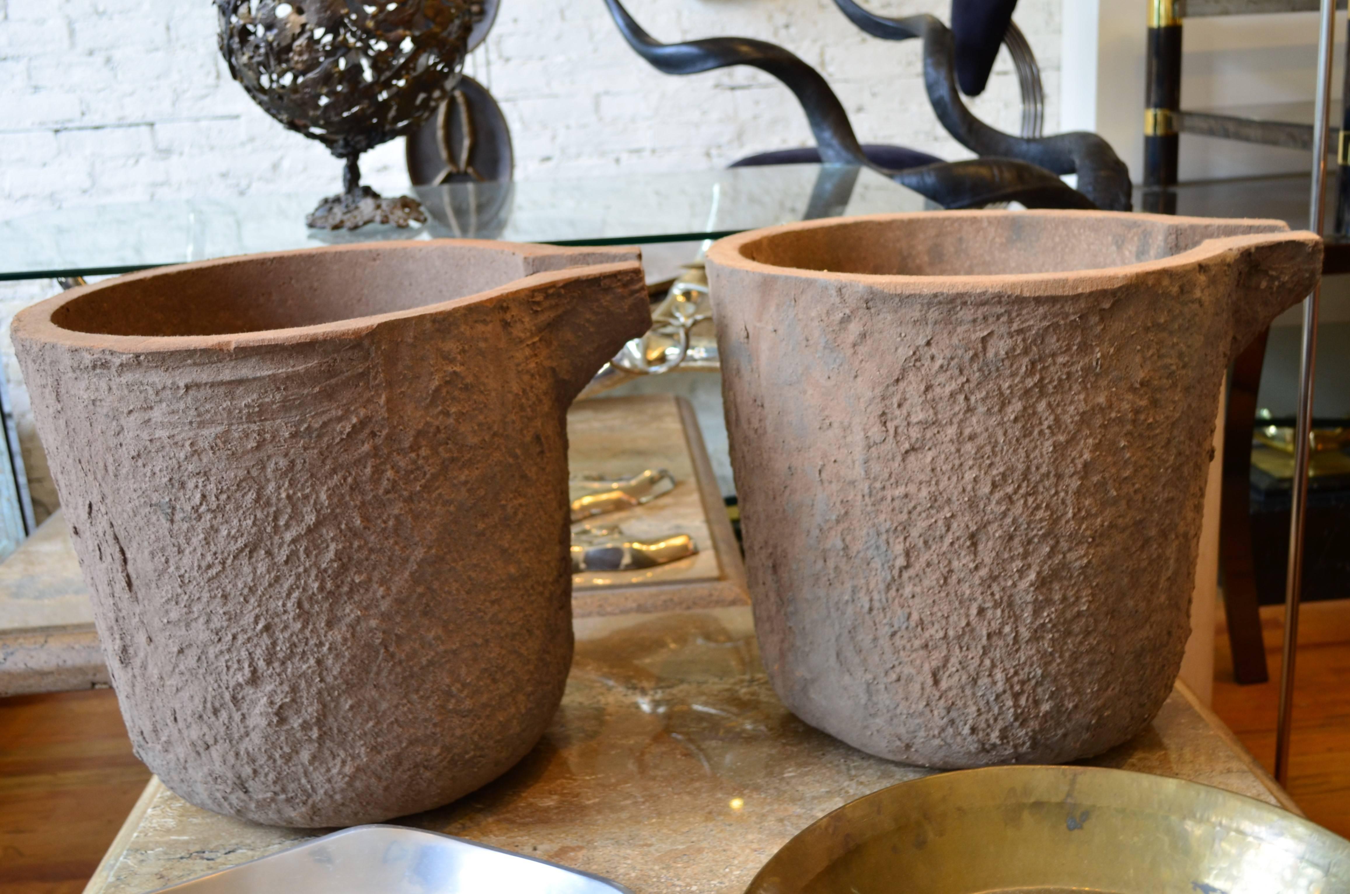 Industrial cauldrons or smelting pots from a steel factory.
They appear to have never been used. Great as large urns or
decorative jardinières. 20th century.