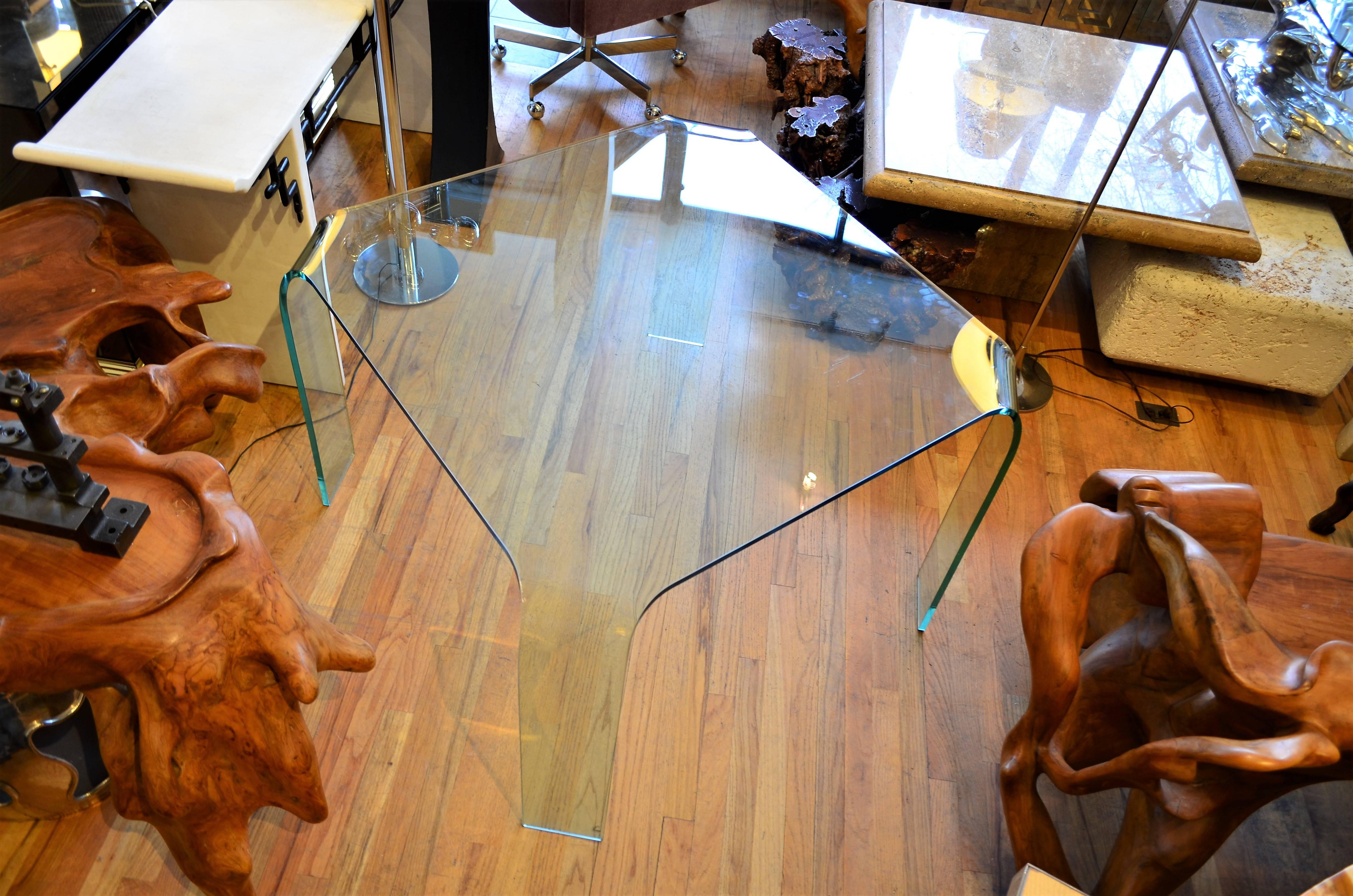 Italian square  glass ghost table by Italian designer Angelo Coertesi.
Fiam Italia was founded by Vittorio Livi in 1973 to produce glass furniture.
Fiam 's furniture was distributed by Pace in the US. Given its size it could also be a center table,
