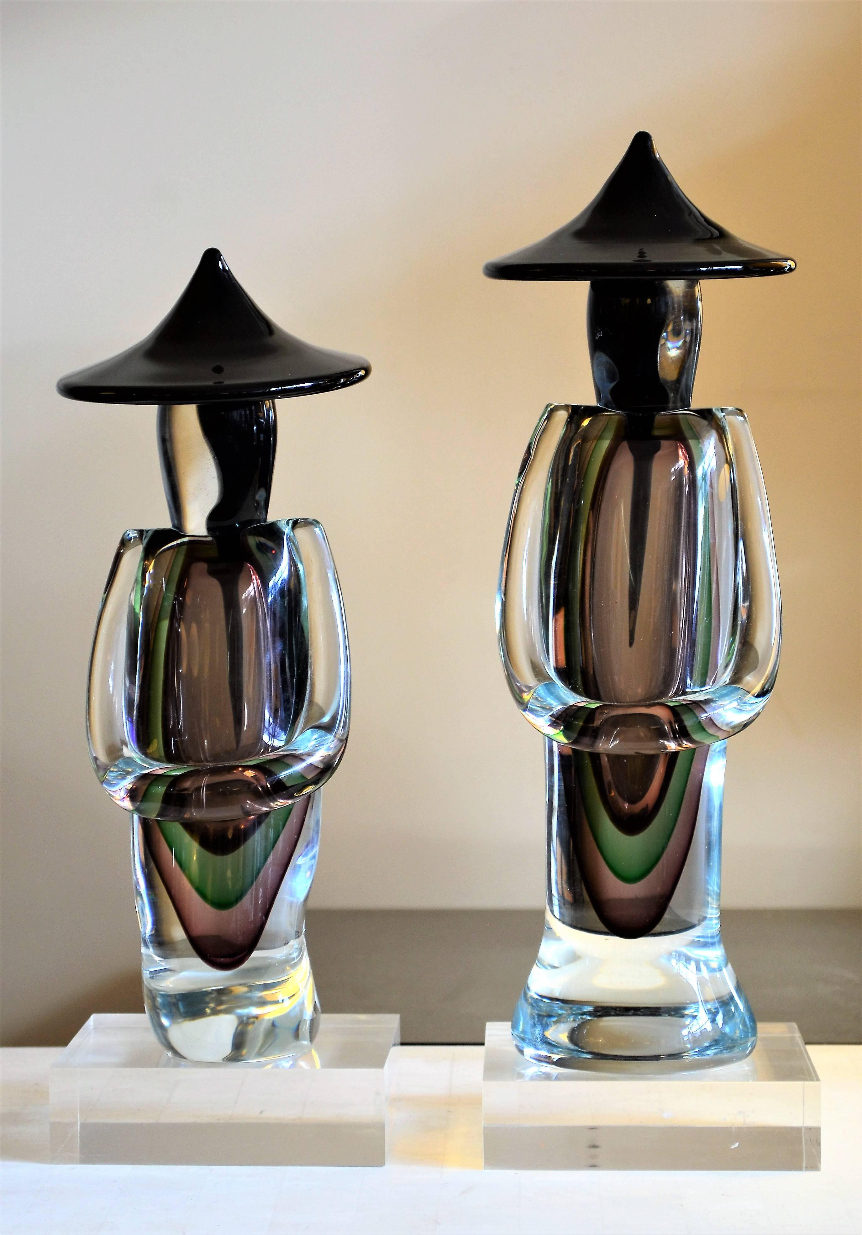 A pair of enchanting large decorative objects by Luigi Onesto for Murano. The abstract modern Asian inspired figures are offered with Lucite bases. Height on the base for the lager item is 16 inches. The shorter figure on the base measures 14