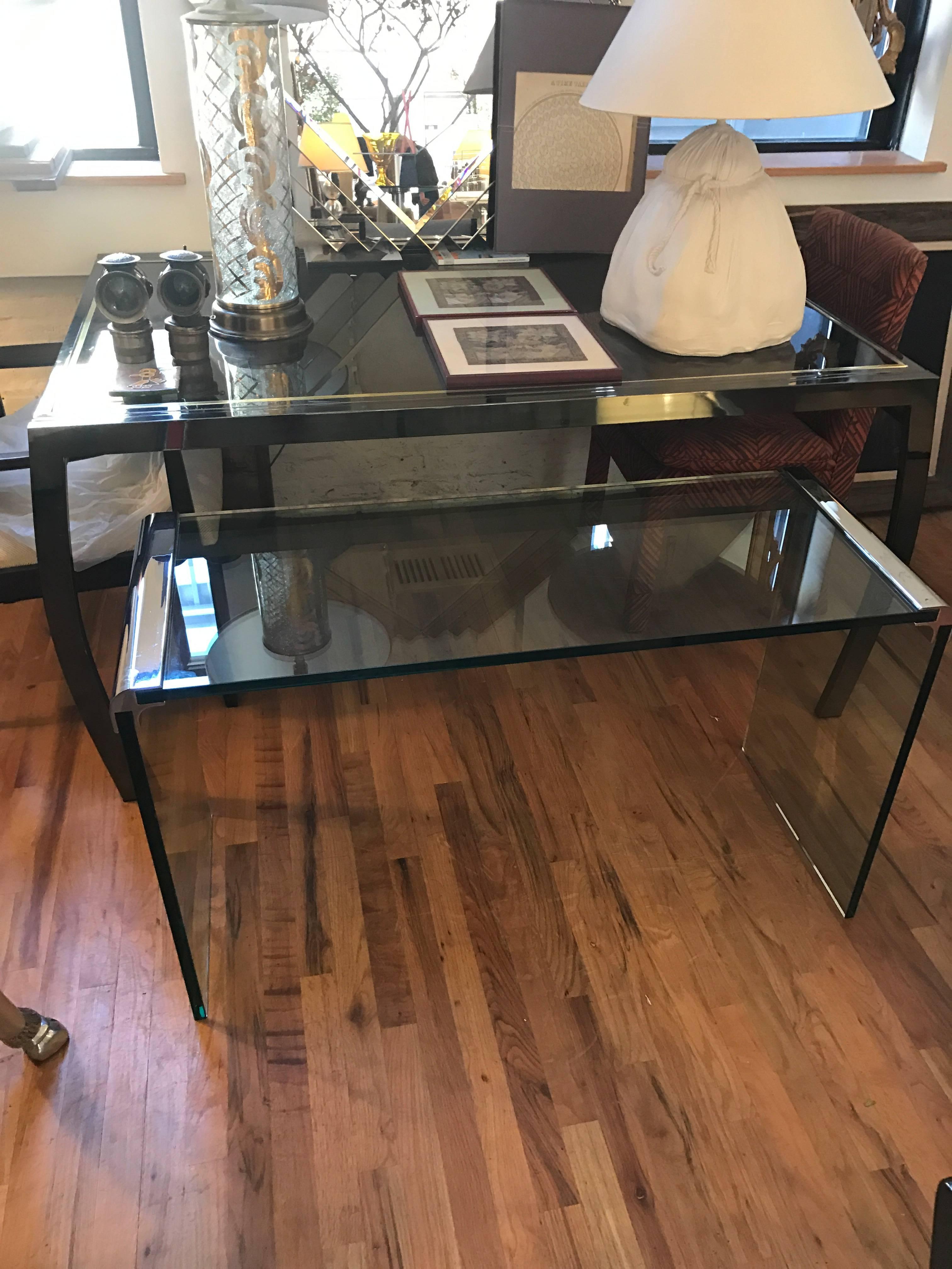 An iconic chrome and glass waterfall console table by Leon Rosen for Pace. This highly versatile Mid-Century Modern table is slightly smaller than the average Pace console table.