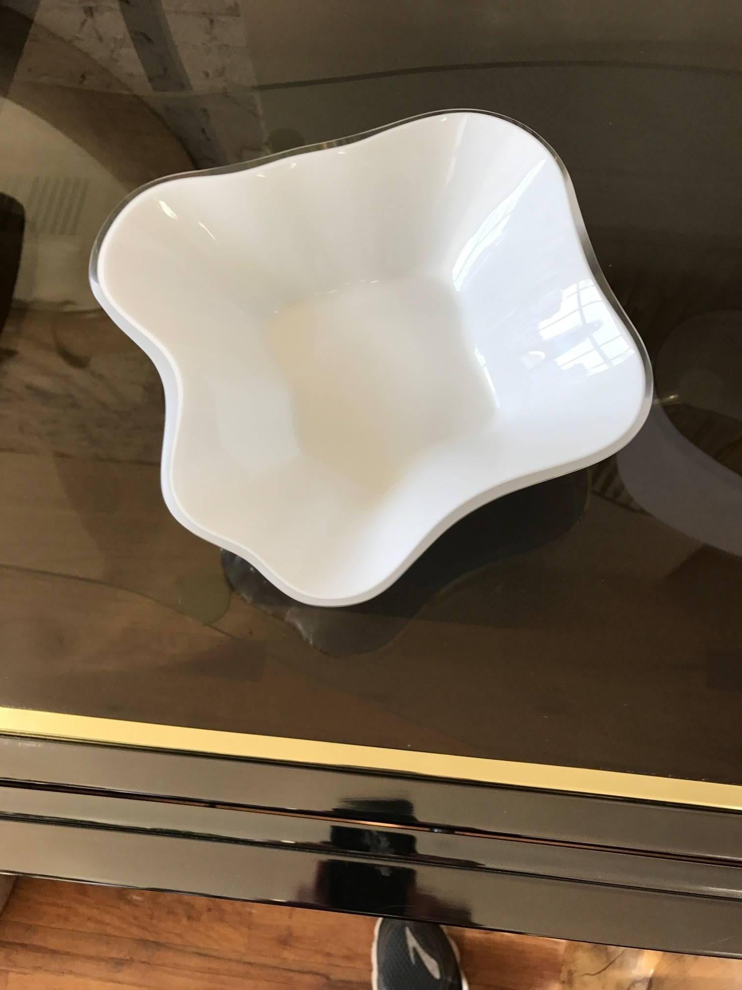 A rare Alvar Aalto organic model #9767 glass dish. Aalto designed the decorative centerpiece for the Karhula Glassworks in Finland. The bowl is stamped Alvar Aalto to the underside. The white glass is cased in clear glass. Fantastic decorative