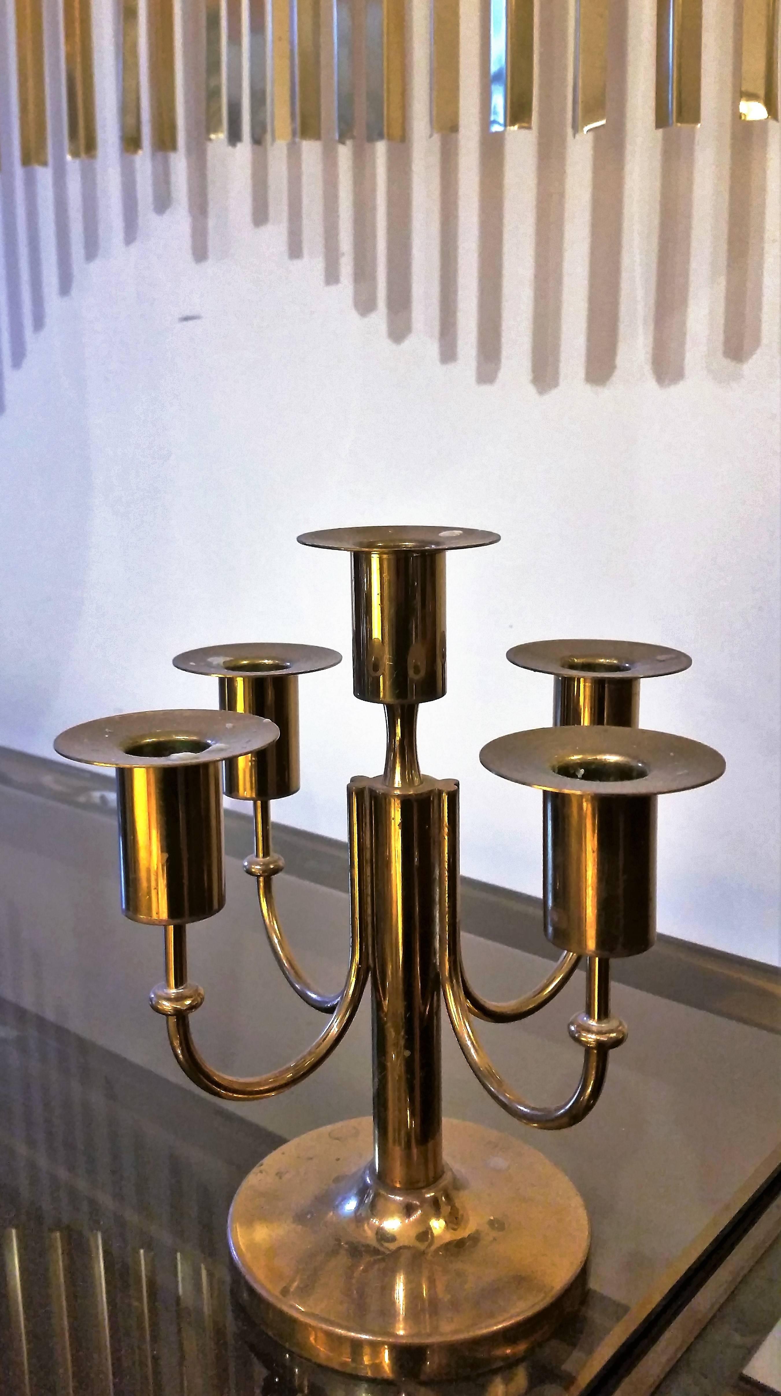 A four-arm candleholder by Tommi Parzinger.