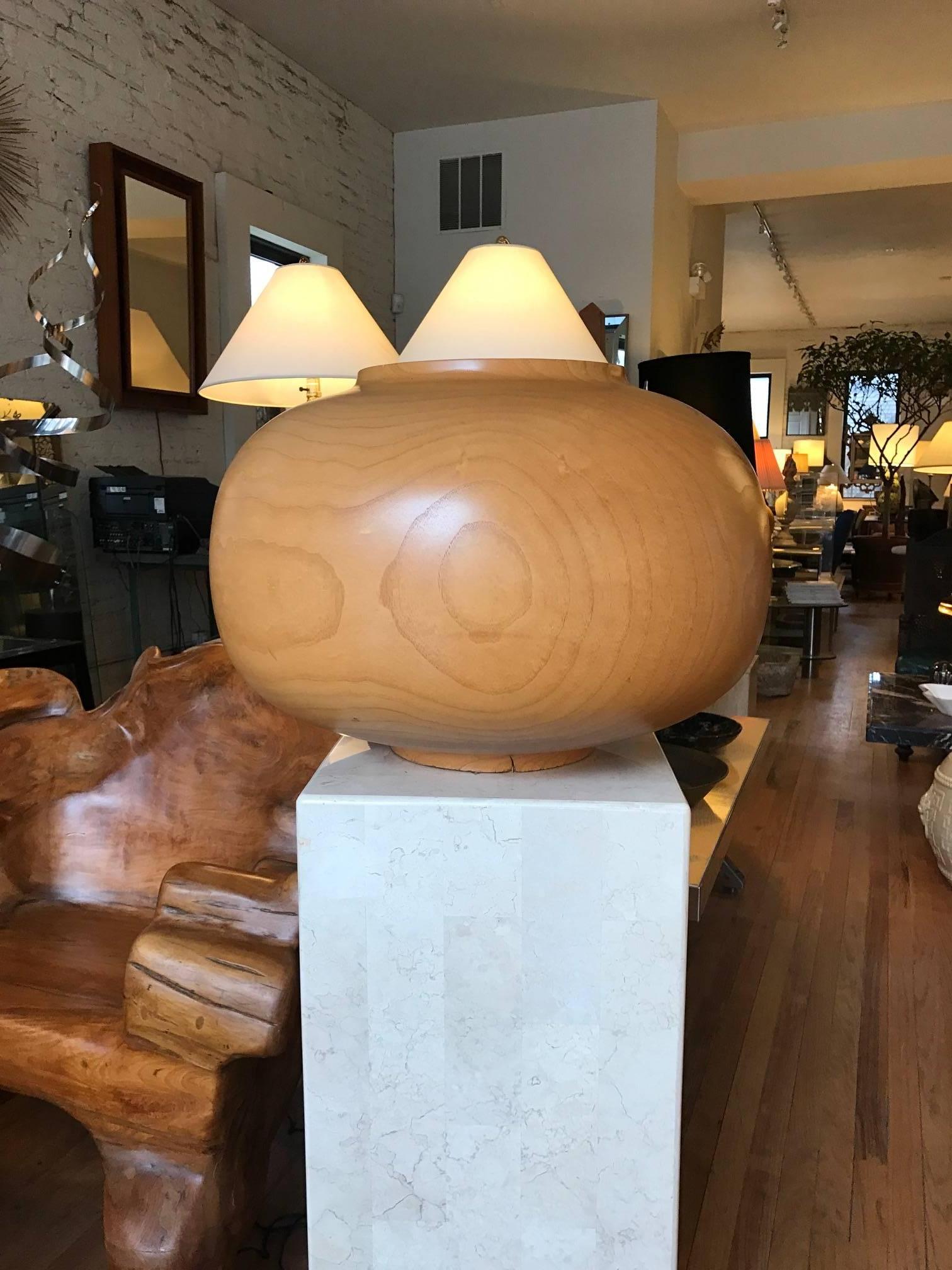 Large hollow form hand-carved ash vessel or vase by Laguna Beach artist Rene Mergroz. Mr Mergroz's work is in the Smithsonian collection. It is signed and dated 1990. This highly sculptural vessel has a rich overall grain pattern. Amongst the
