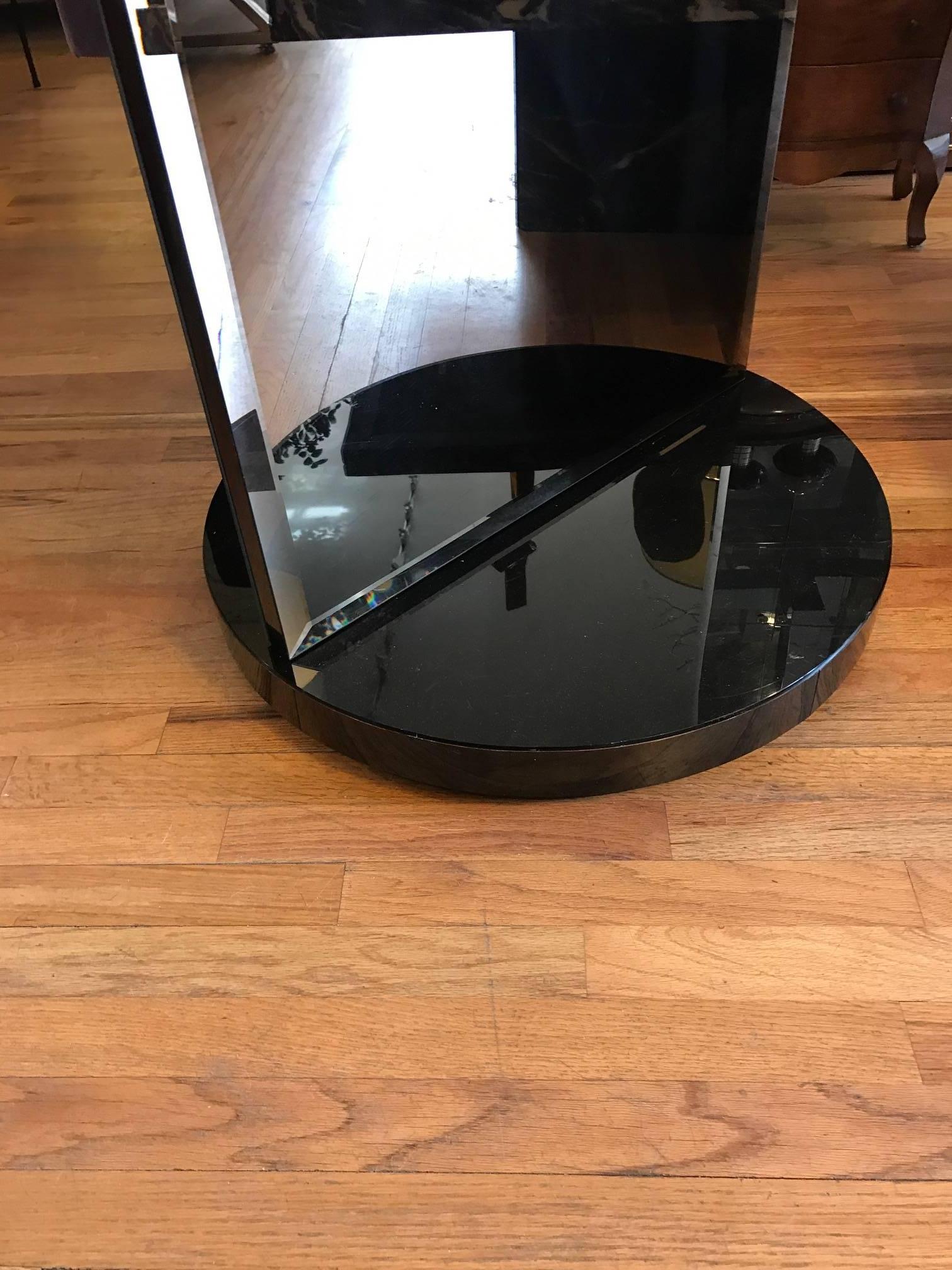 Revolving floor mirror. The floor mirror rotates. One side has a slight bronze tint to the mirror.
The top mirrored circle slides back and forth. Fantastic sculptural piece. Please see images. 