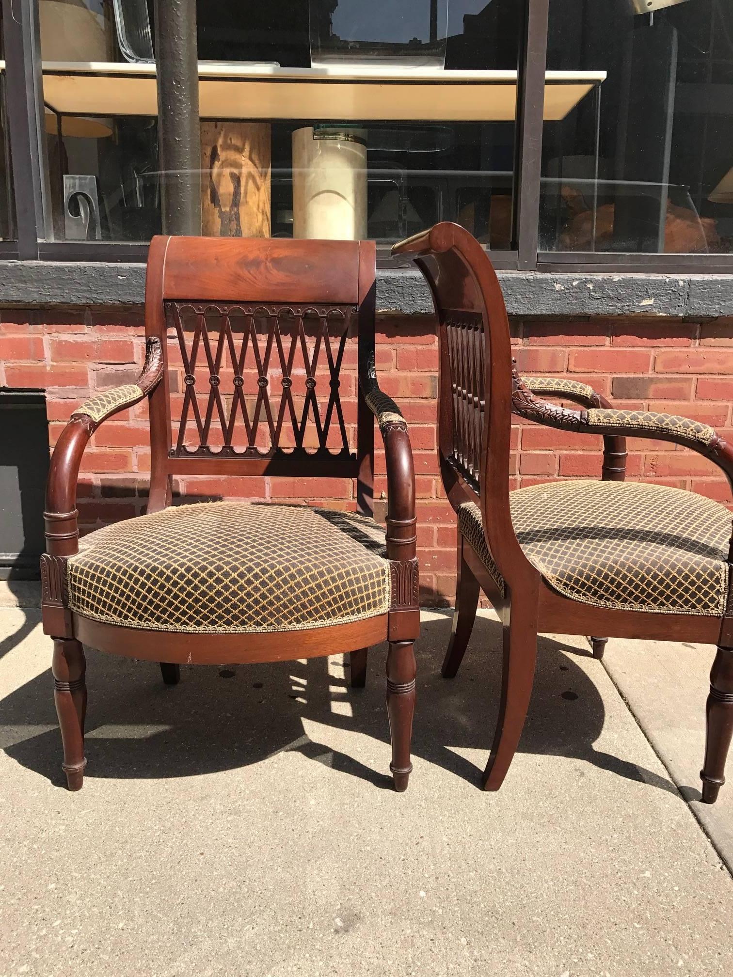 French 18th century mahogany fauteuils. The armchairs are attributed to Henri Jacob 1753-1824. The Empire chairs have a carved lattice back with a gently cured top. These chairs exhibit the finest neoclassic form of the Directroir period.

   