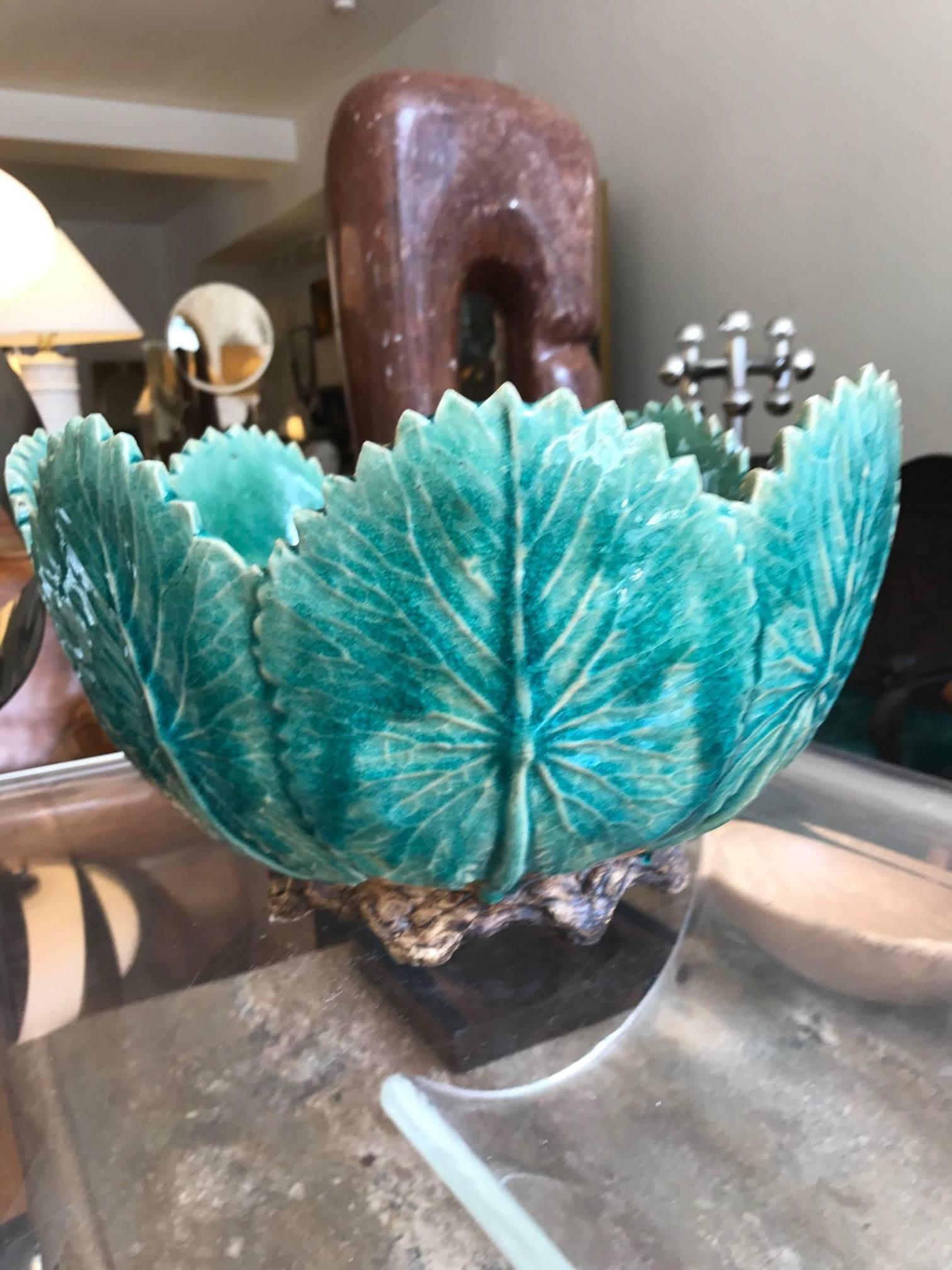 A large-scale 19th century Majolica ceramic centrepiece bowl. The bowl features upright cabbage leaves. Striking decorative glazed ceramic object.