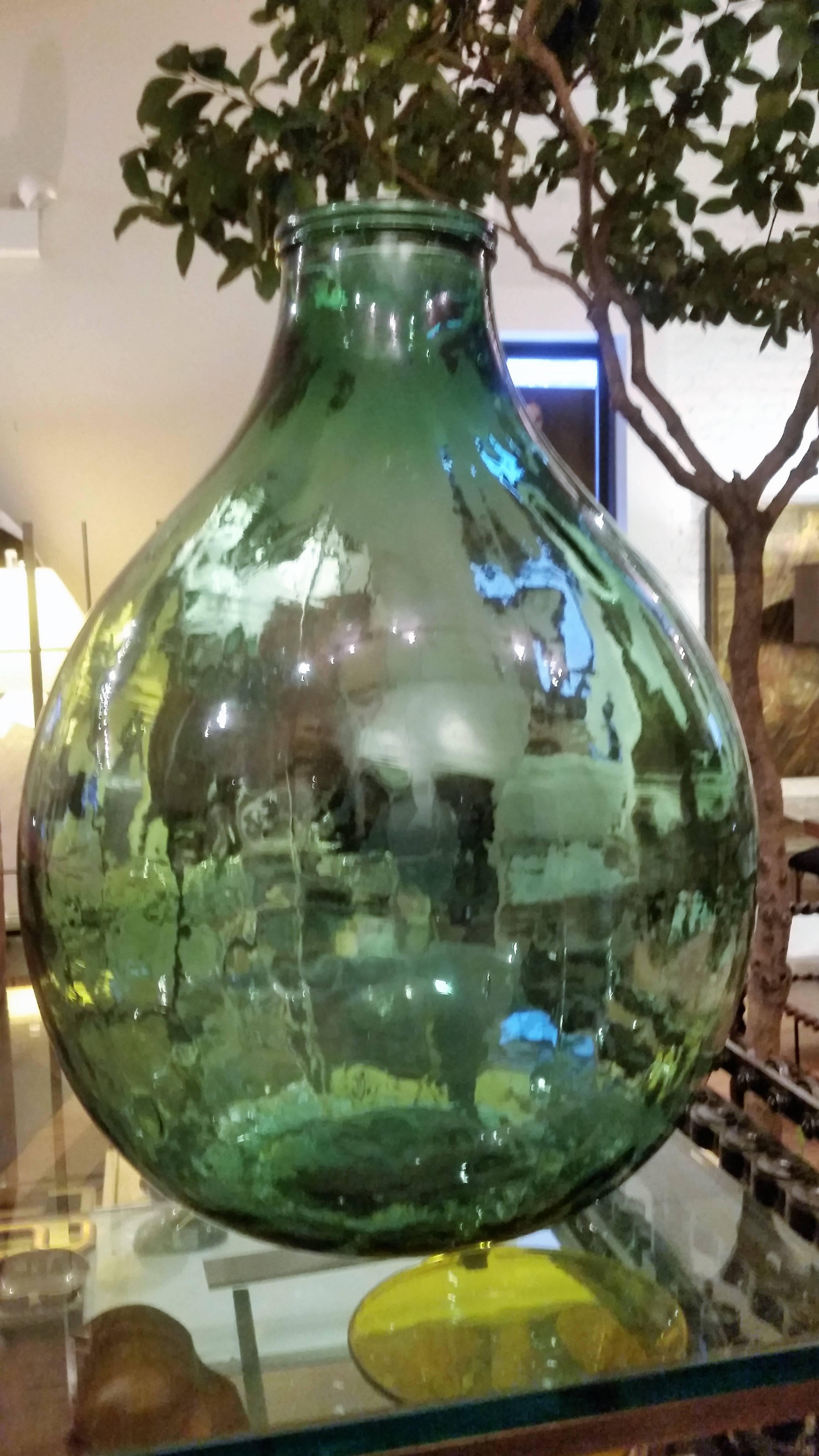 An enormous green glass bottle.