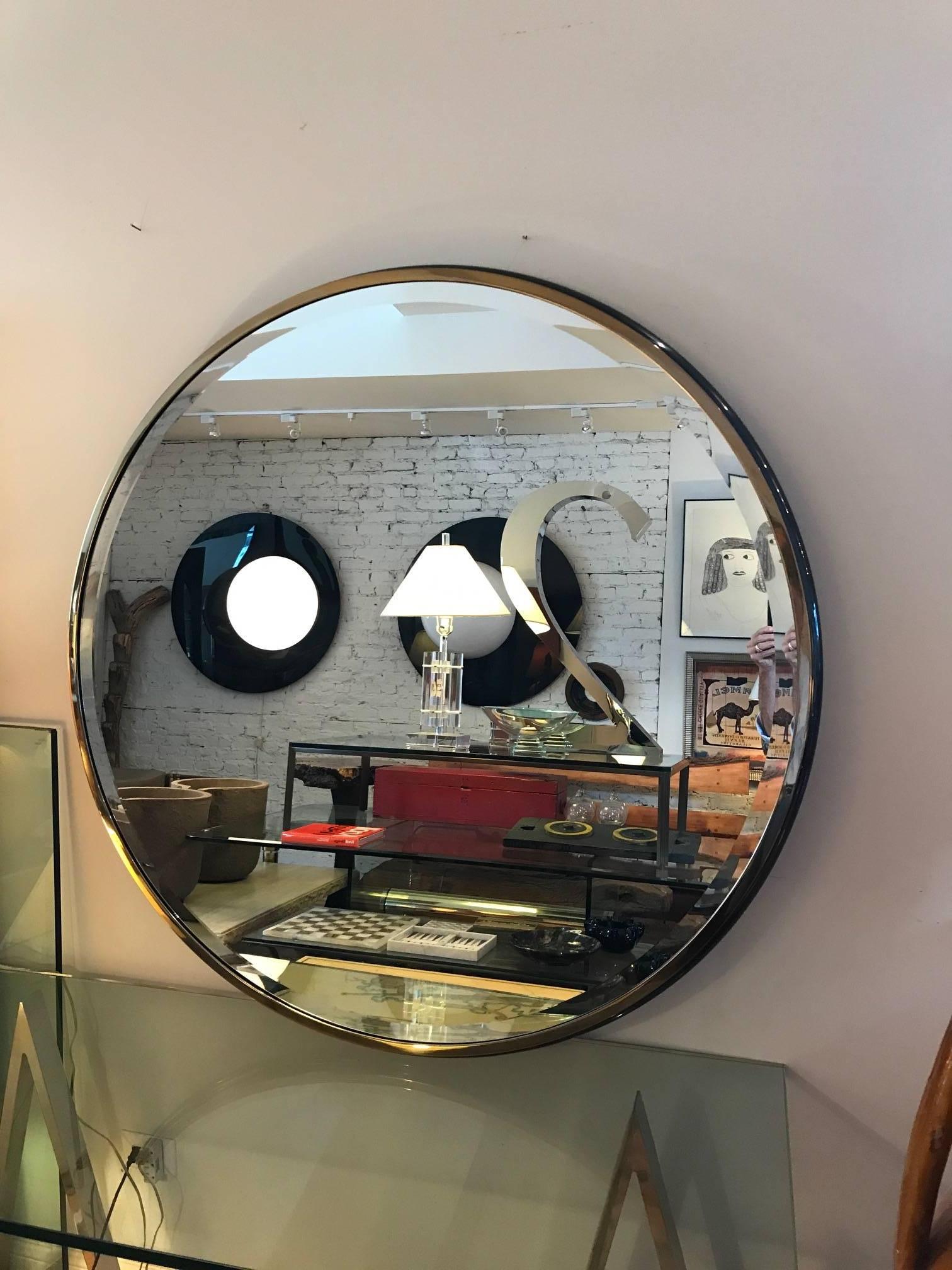 Round monumental gunmetal and brass beveled mirror designed by J Wade Beam for Brueton. The large  mirror is has a seamless metal frame with an ogee profile.