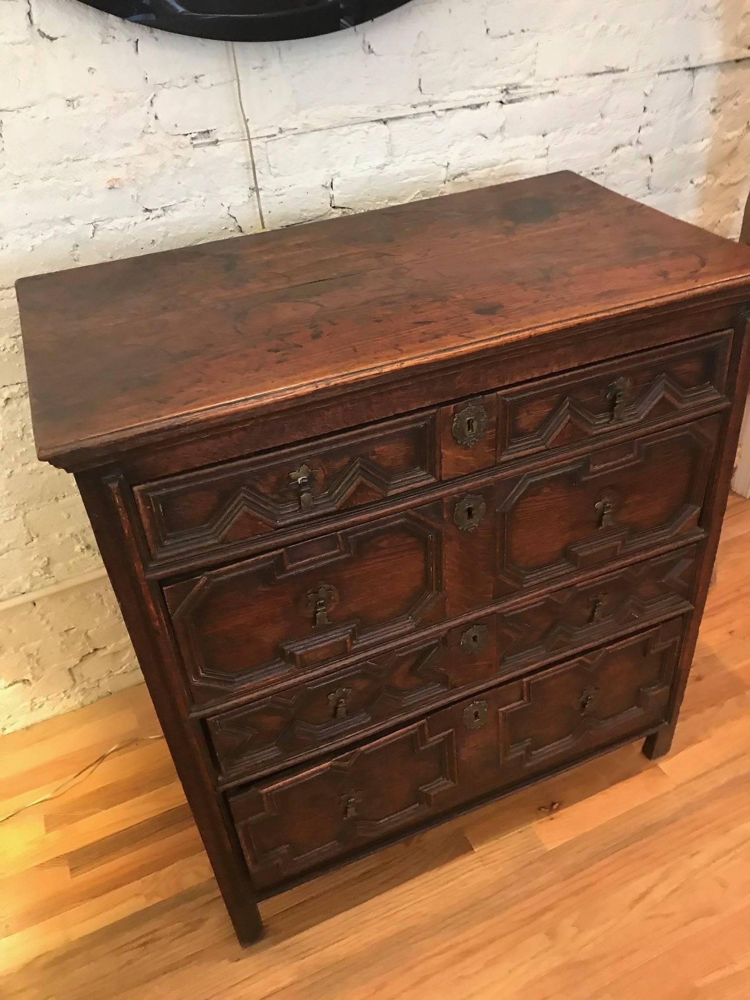 Magnificent English Charles II oak chest of drawers. It front drawers features bold geometric moldings.