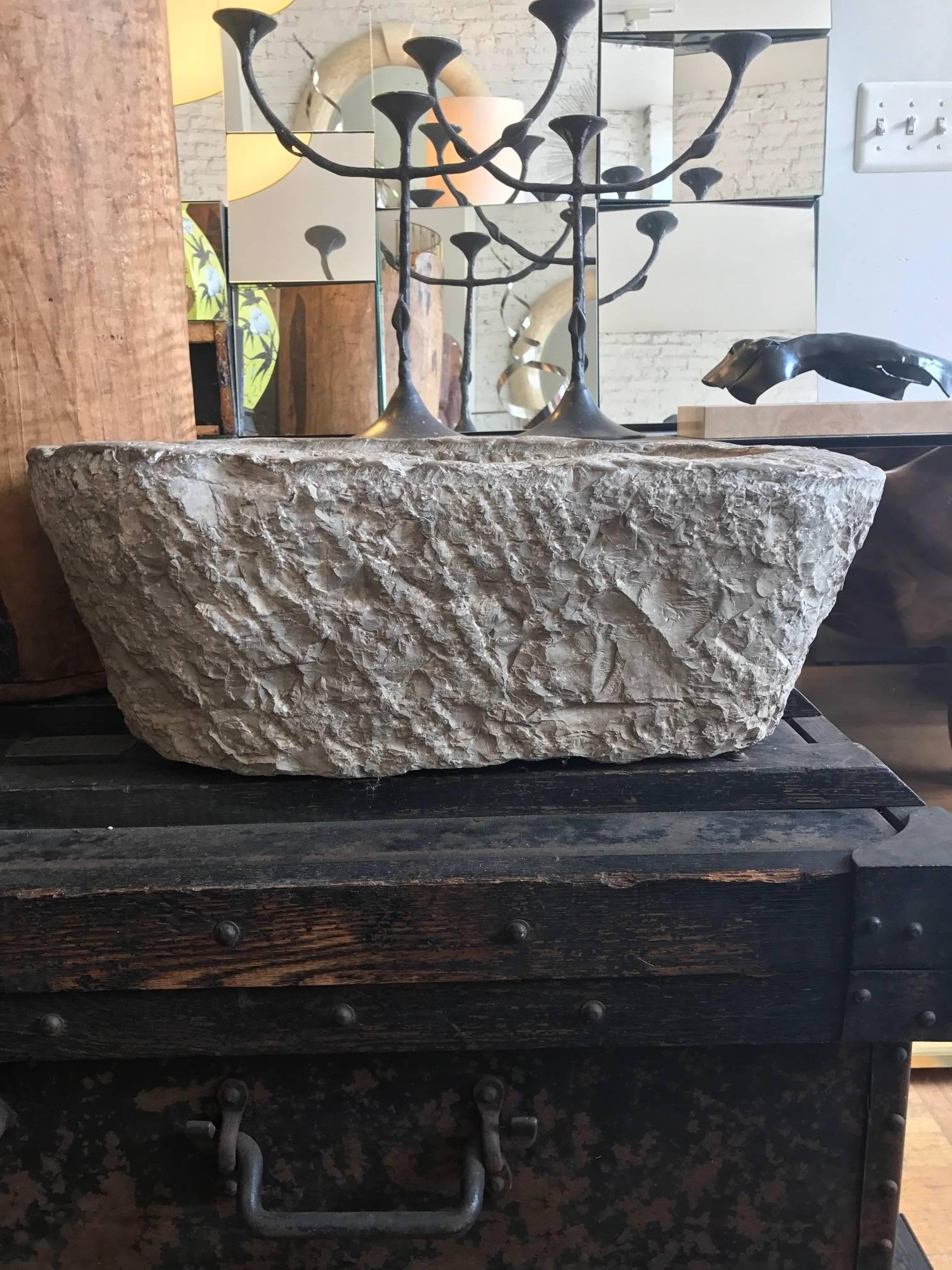 Hand-carved Chinese limestone oval mortar or trough. Fashioned out of a single block of limestone. Great inside or in the garden as a decorative vessel or a sculptural birdbath.