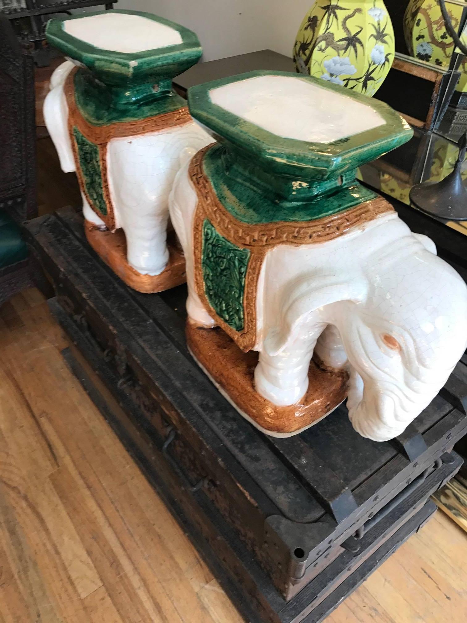 Pair of Italian ceramic elephant garden stools or drinks tables.
Great details in white and green crackle glaze great inside or outside as a side or end table.